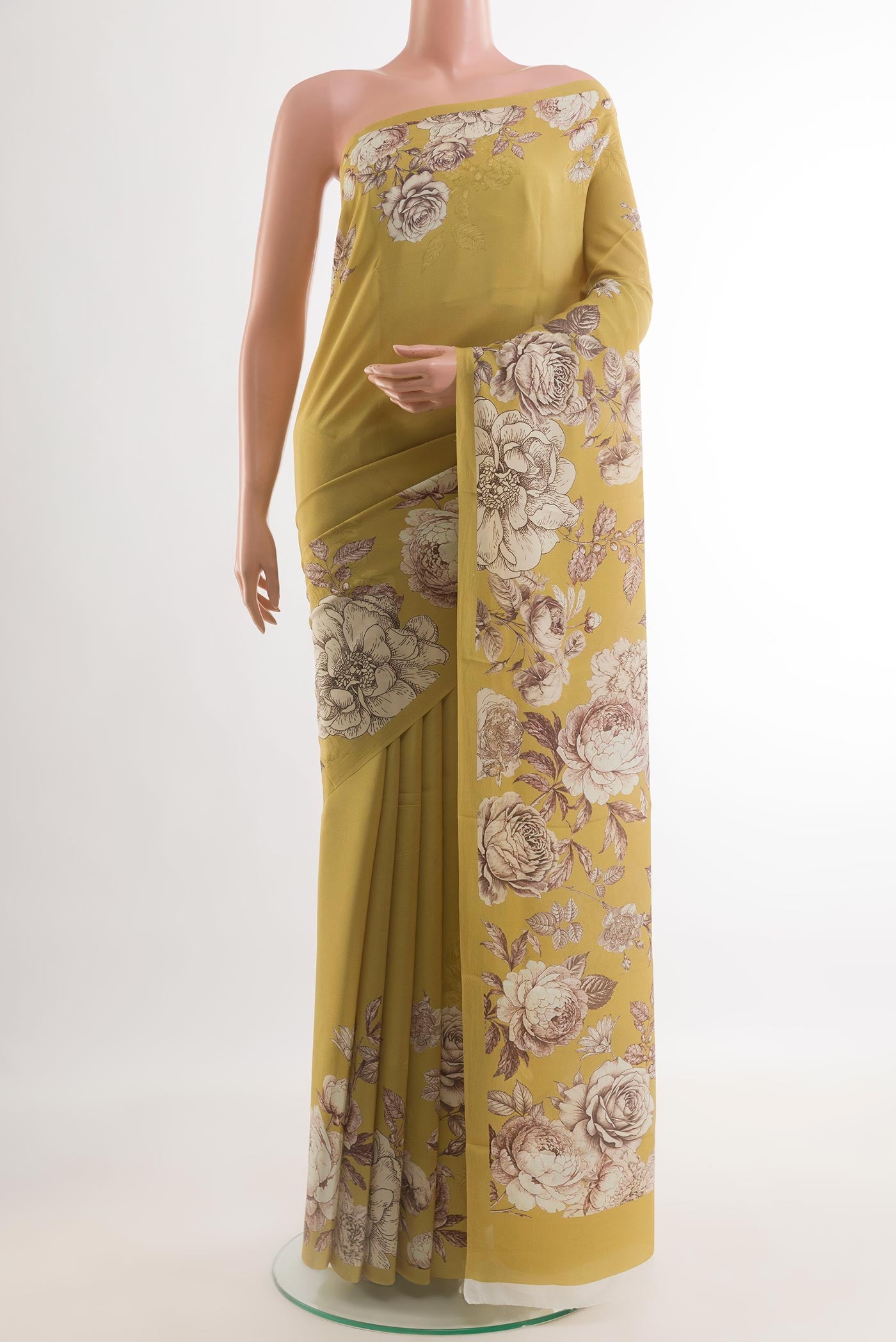 Yellow Crepe Saree with Printed design on the body and Plain Border.  displayed on a mannequin