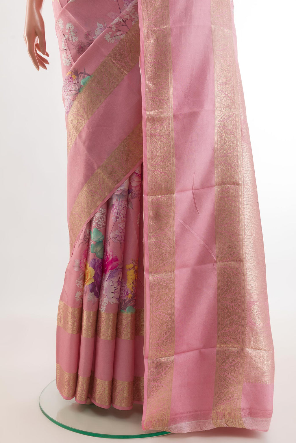 Pleats and pallu of Pink Printed Silk Saree with Floral Print on the body and Zari Border. 