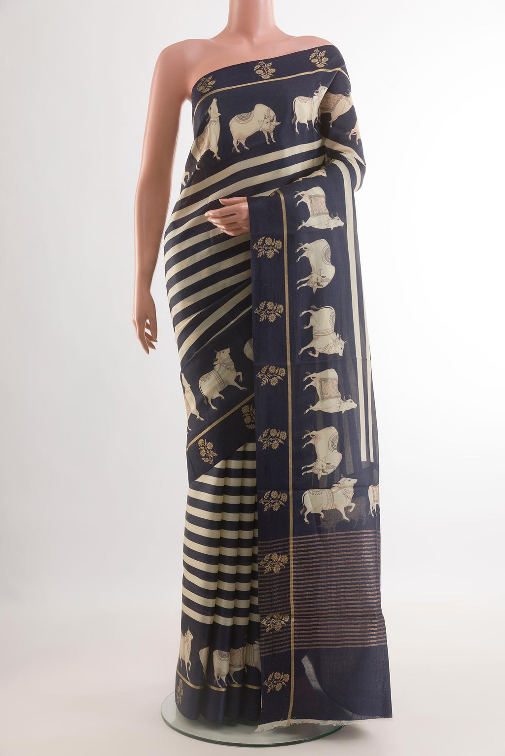 Dark Blue Tussar Silk Saree with Stripes on the body and Printed Border.  displayed on a mannequin