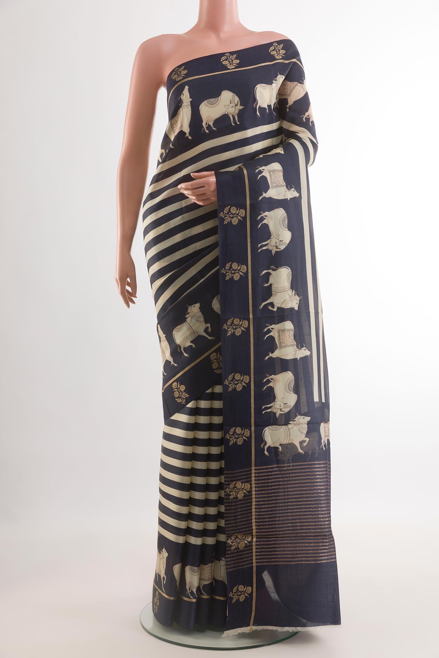 Dark Blue Tussar Silk Saree with Stripes on the body and Printed Border.  displayed on a mannequin