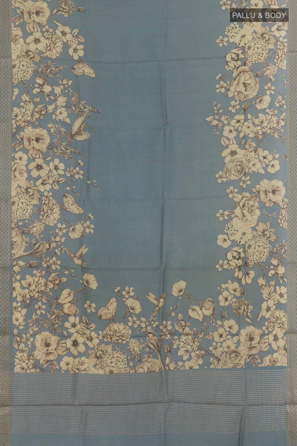 Flat view of Grey Tussar Silk Saree with Printed design on the body and Zari Border. 
