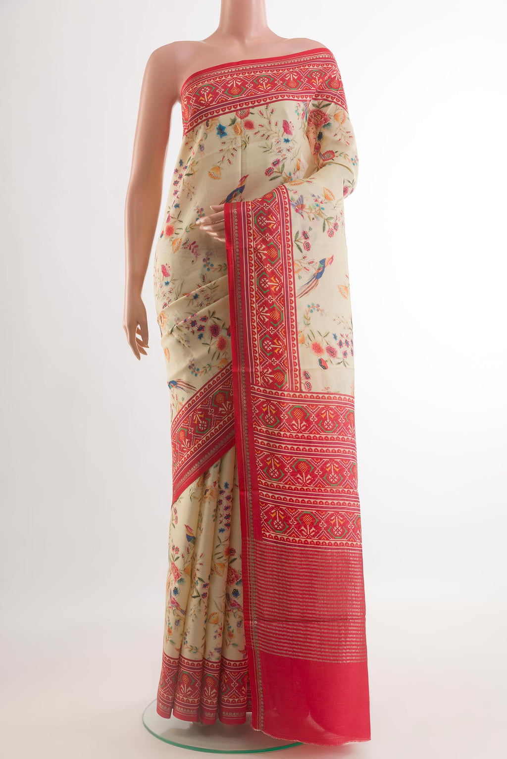 Off White Tussar Silk Saree with Printed design on the body and Printed Border.  displayed on a mannequin