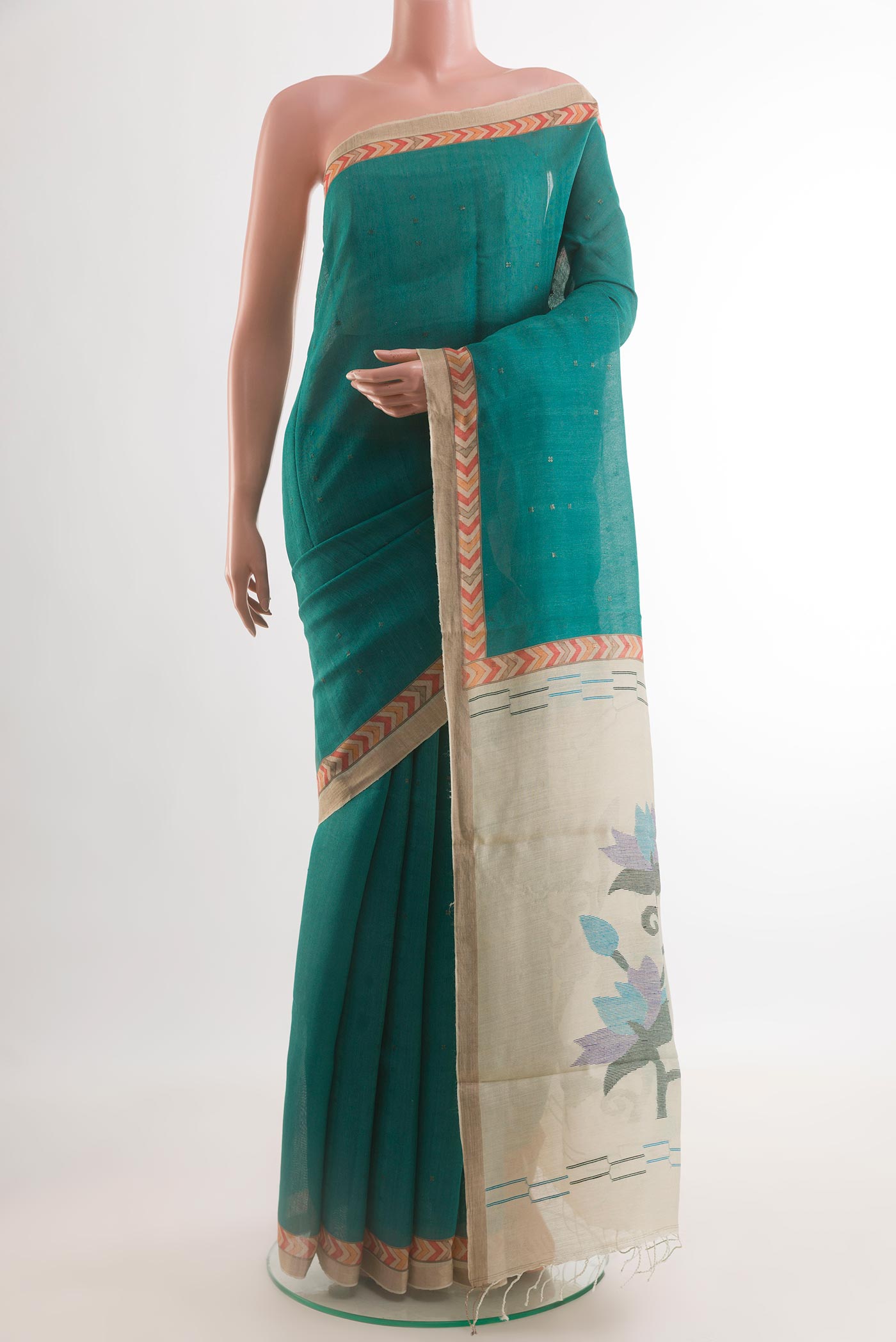 Blue Tussar Silk Saree with Embroidery on the body and Printed Border.  displayed on a mannequin