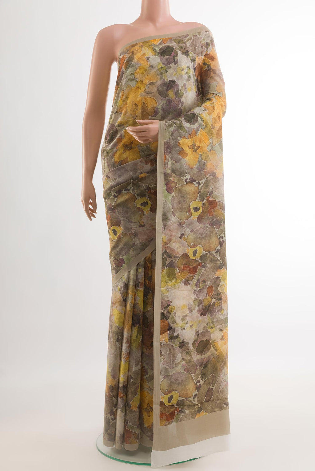 Grey Crepe Saree with Printed design on the body and Plain Border.  displayed on a mannequin