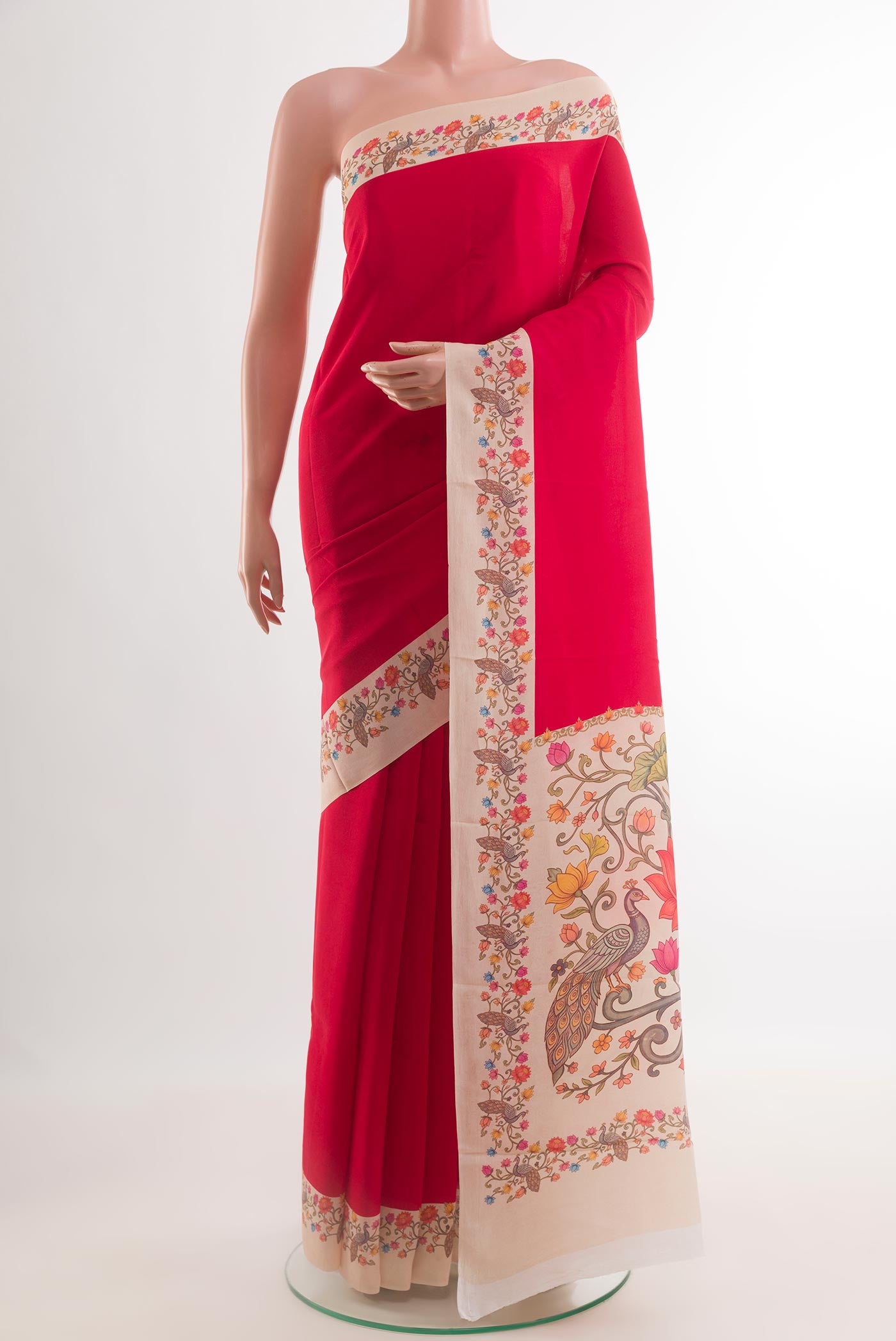 Red Crepe Saree with Plain Body and Printed Border.  displayed on a mannequin