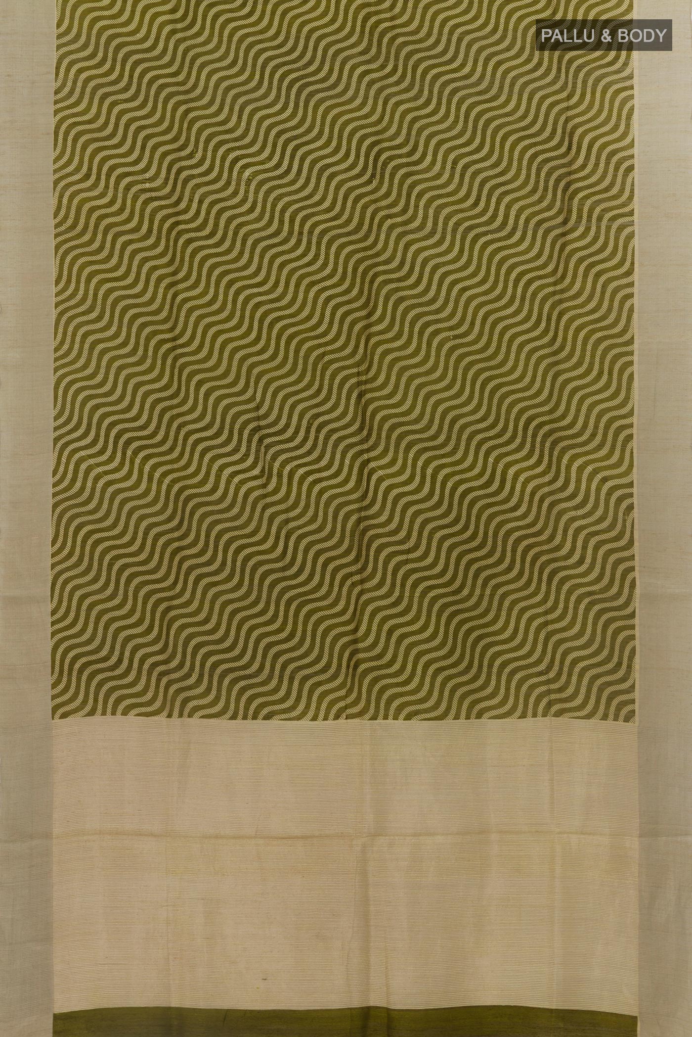 Flat view of Green Tussar Silk Saree with Printed design on the body and Zari Border. 