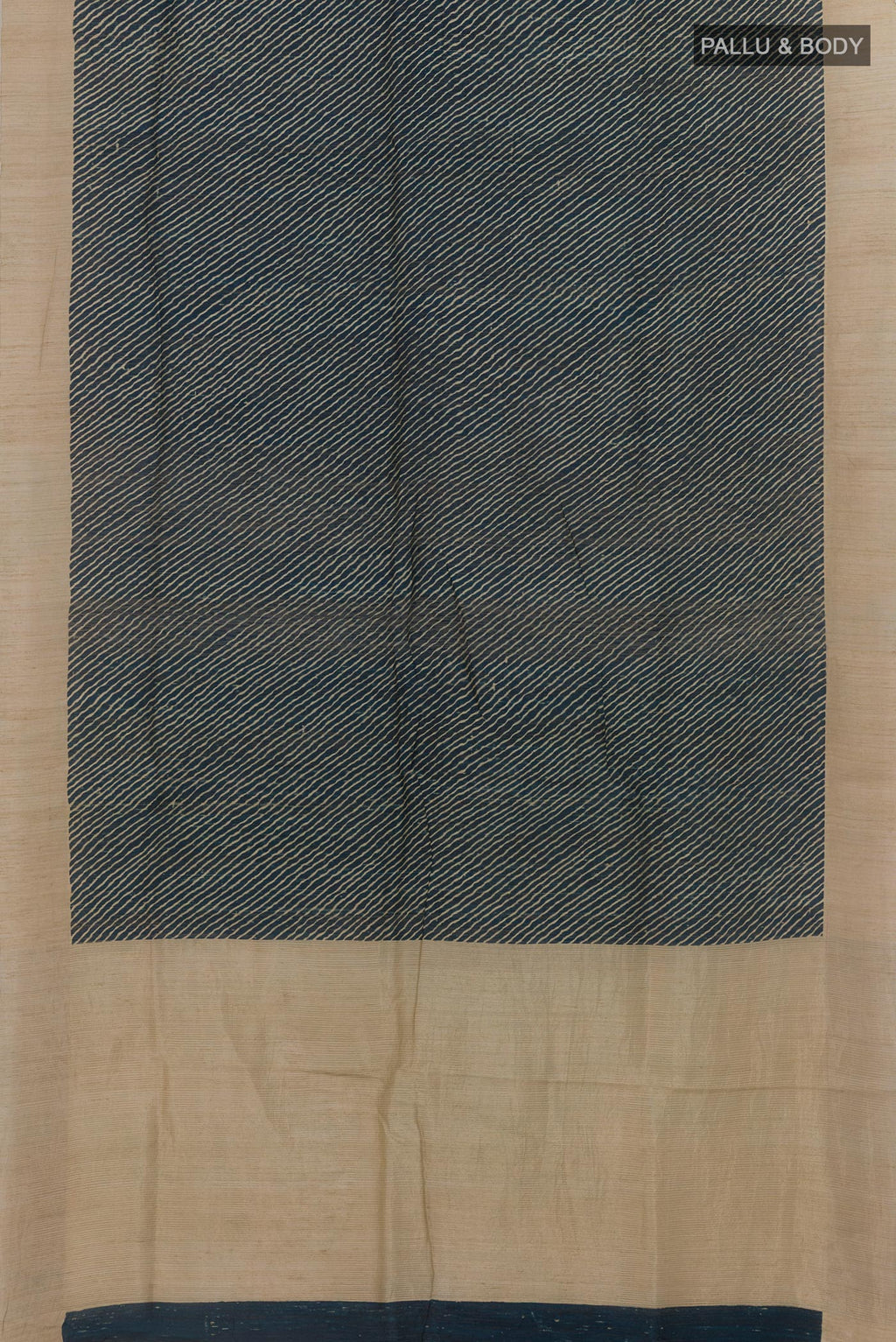 Flat view of Blue Tussar Silk Saree with Printed design on the body and Zari Border. 