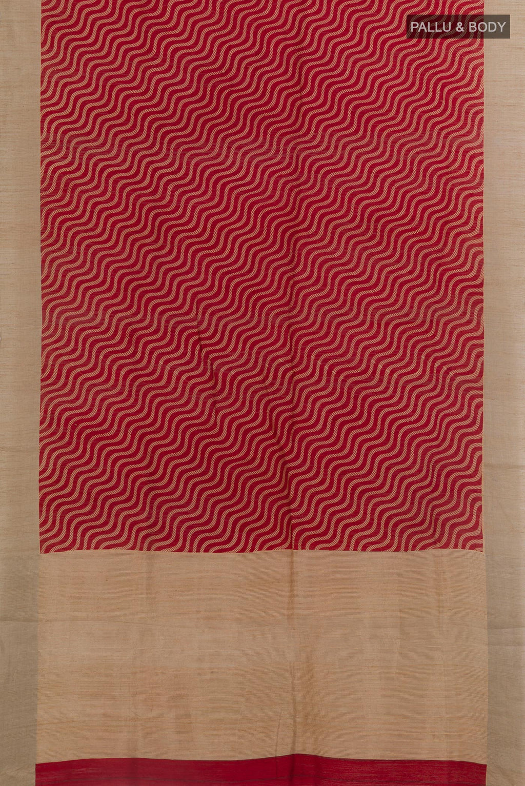 Flat view of Red Tussar Silk Saree with Printed design on the body and Zari Border. 