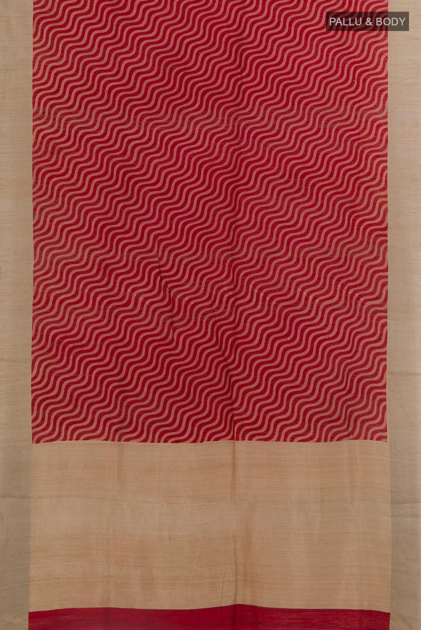 Flat view of Red Tussar Silk Saree with Printed design on the body and Zari Border. 