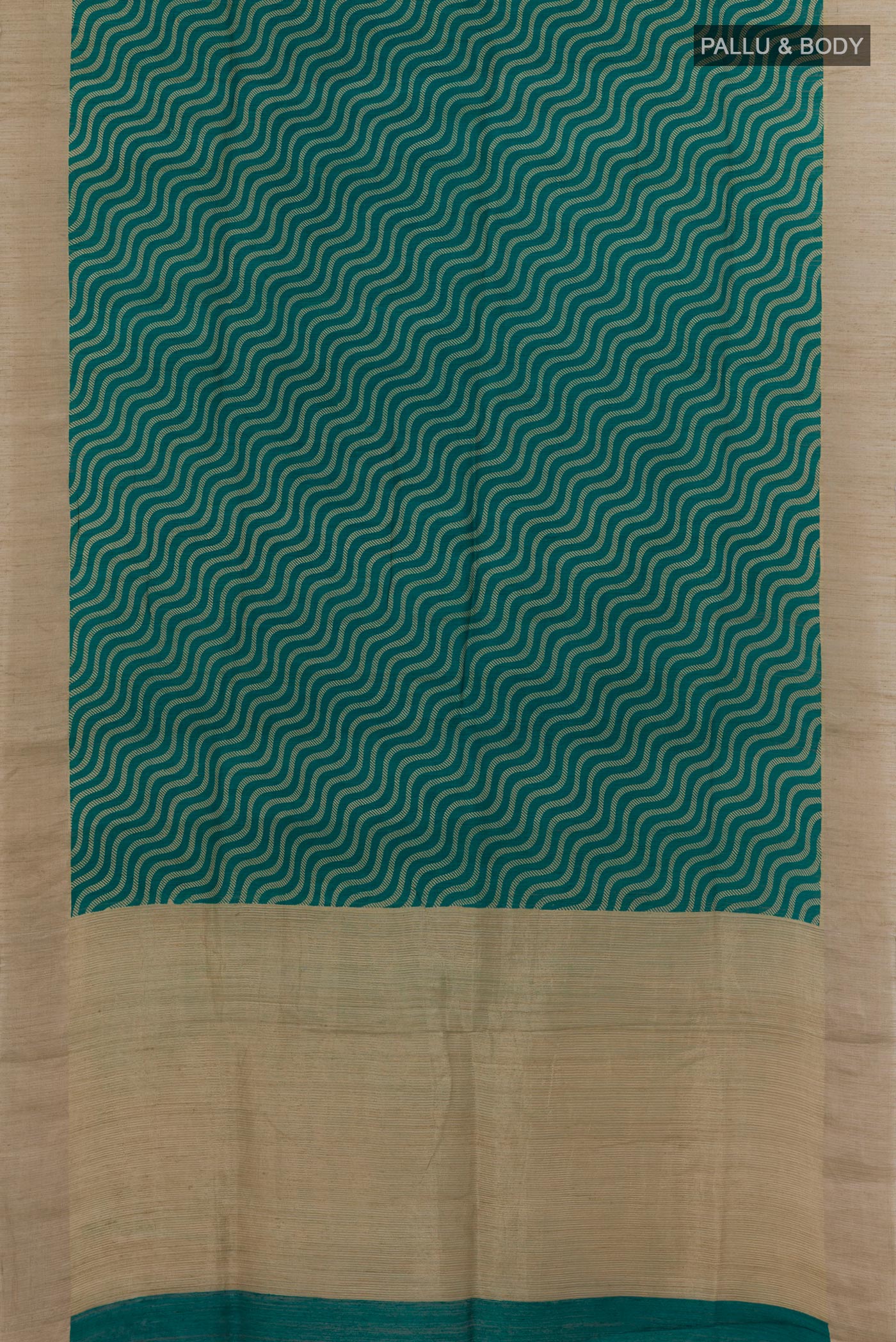 Flat view of Sea Green Tussar Silk Saree with Printed design on the body and Zari Border. 