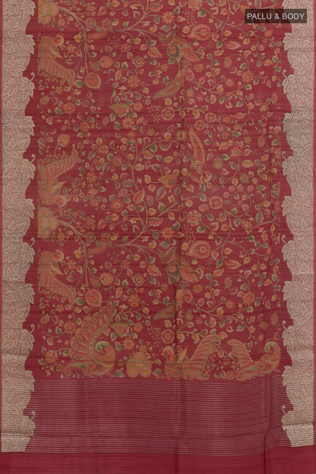 Flat view of Maroon Tussar Silk Saree with Printed design on the body and Zari Border. 