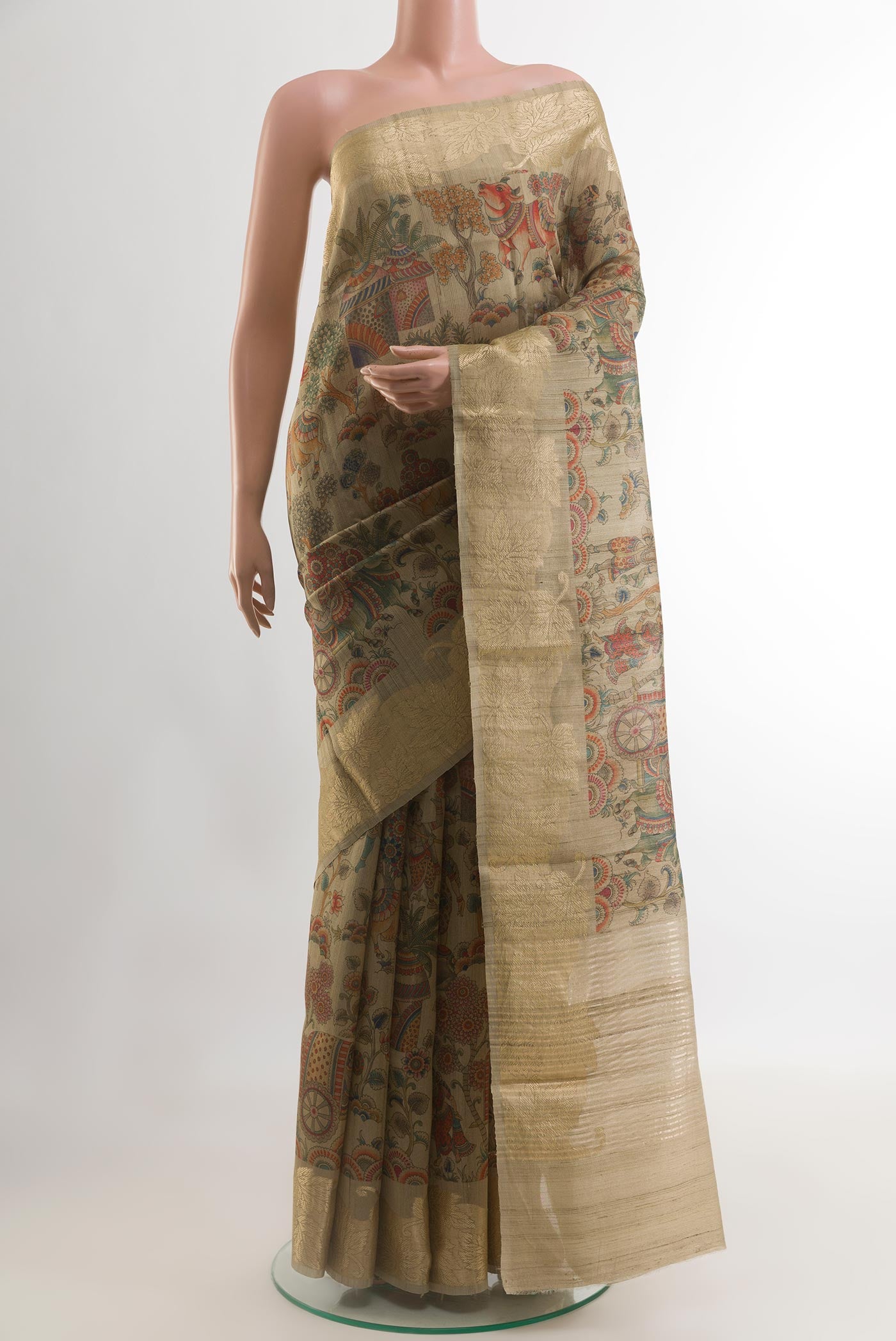 Beige Tussar Silk Saree with Printed design on the body and Zari Border.  displayed on a mannequin