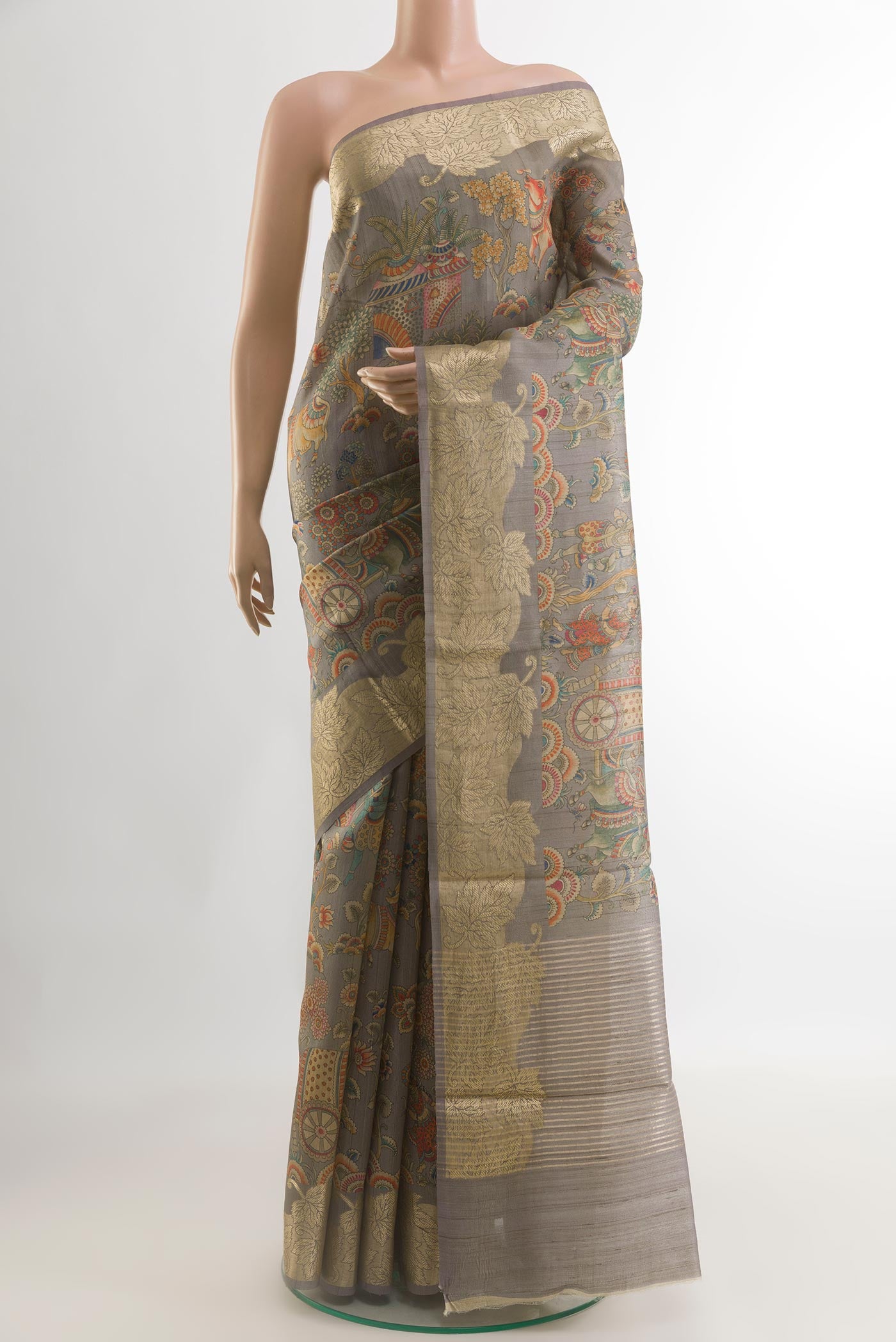 Grey Tussar Silk Saree with Floral Print on the body and Zari Border.  displayed on a mannequin