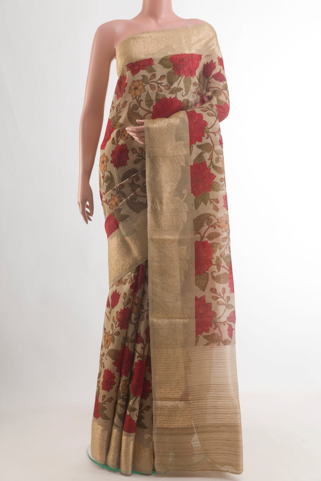 Beige Tussar Saree with Printed design on the body and Zari Border.  displayed on a mannequin