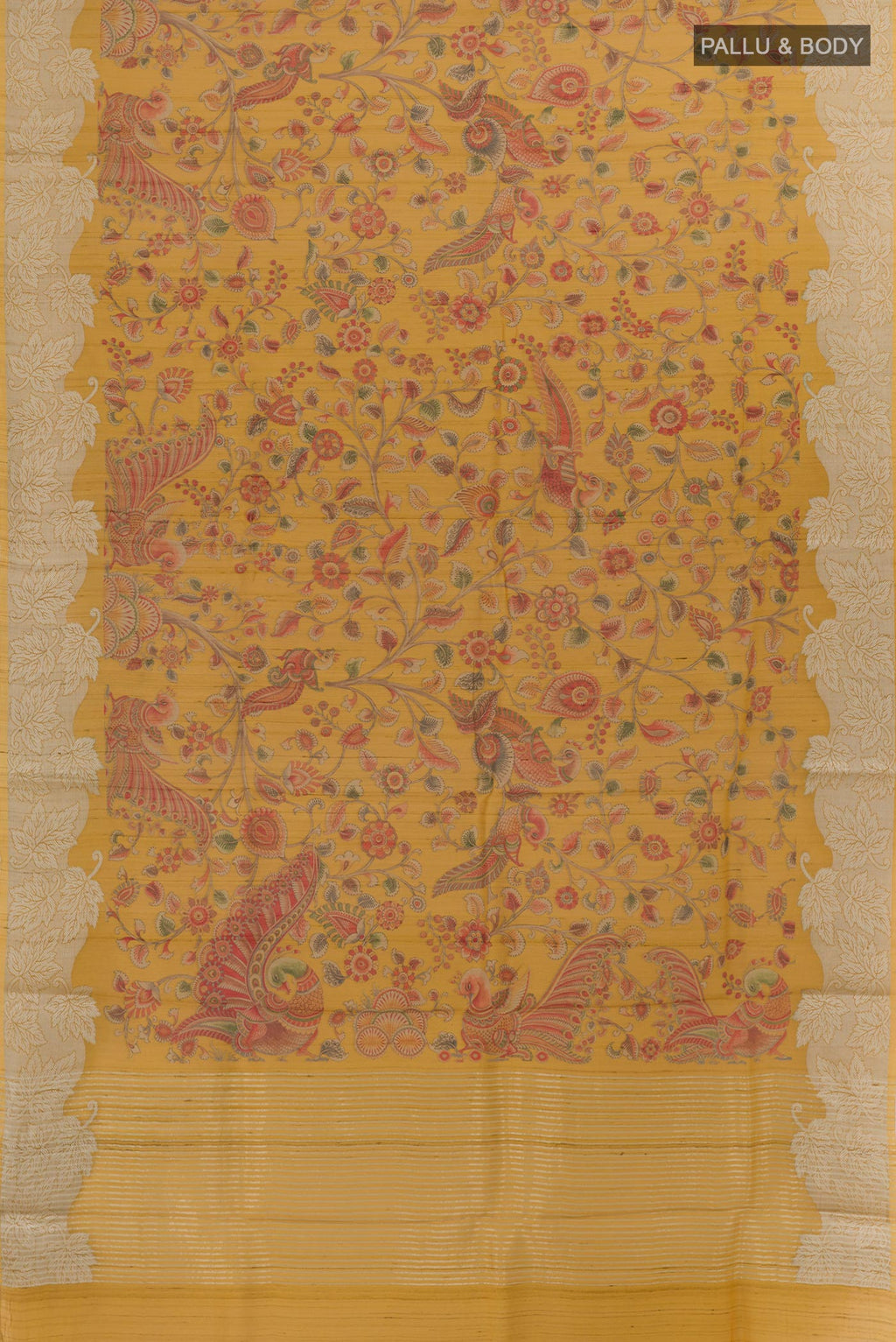 Flat view of Mustard Tussar Silk Saree with Printed design on the body and Zari Border. 