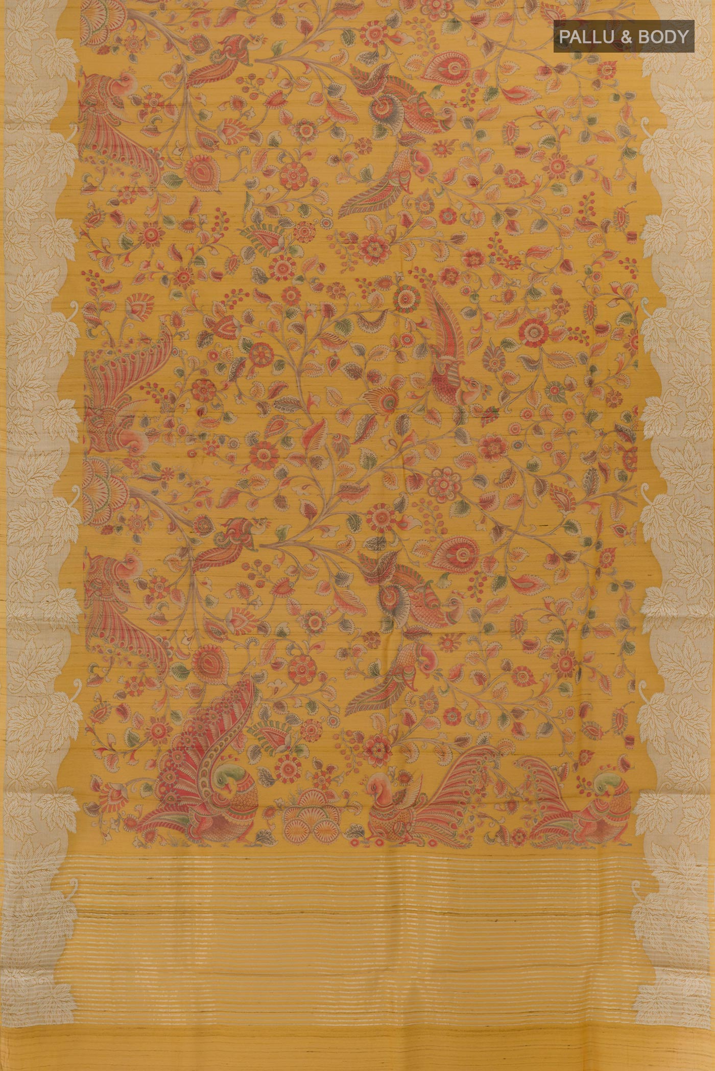 Flat view of Mustard Tussar Silk Saree with Printed design on the body and Zari Border. 