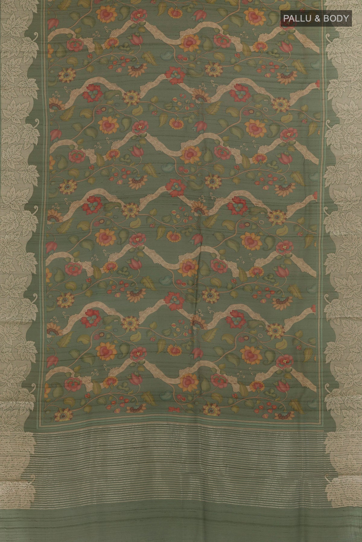 Flat view of Green Tussar Saree with Printed design on the body and Zari Border. 
