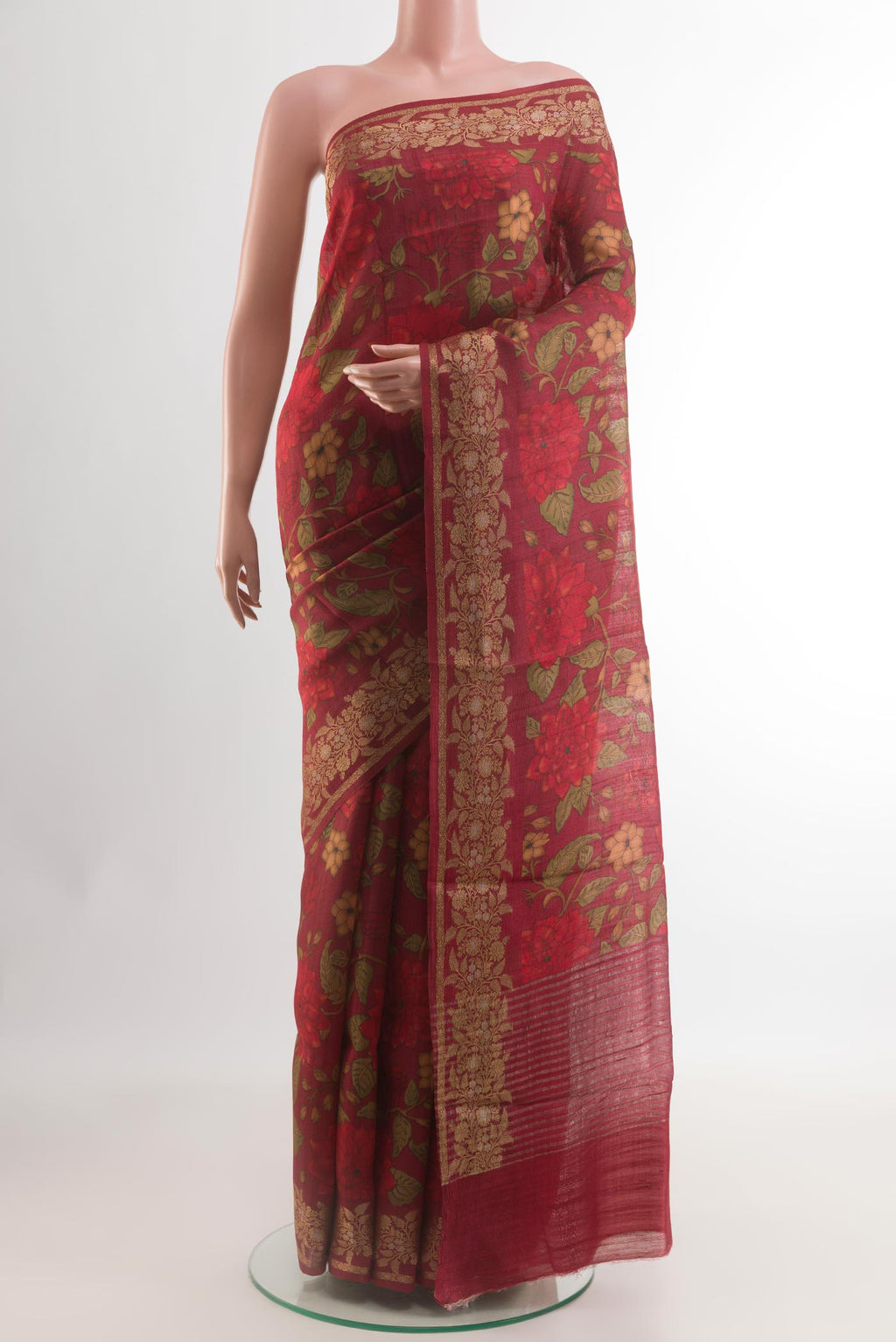 Maroon Tussar Silk Saree with Printed design on the body and Zari Border.  displayed on a mannequin