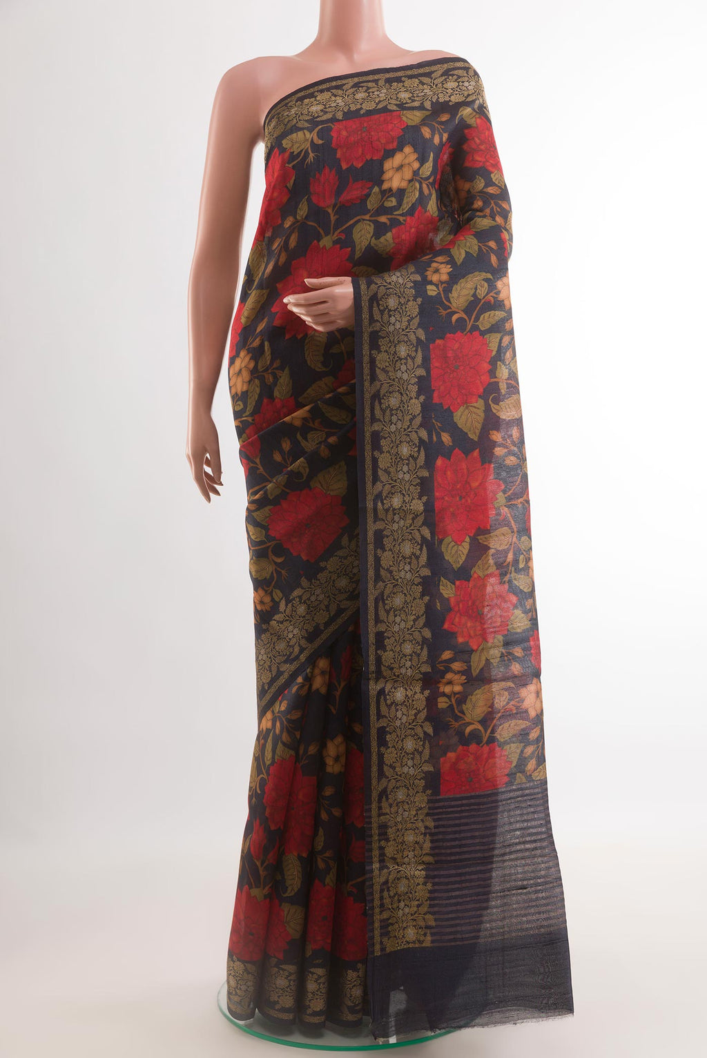 Navy Blue Tussar Silk Saree with Printed design on the body and Zari Border.  displayed on a mannequin
