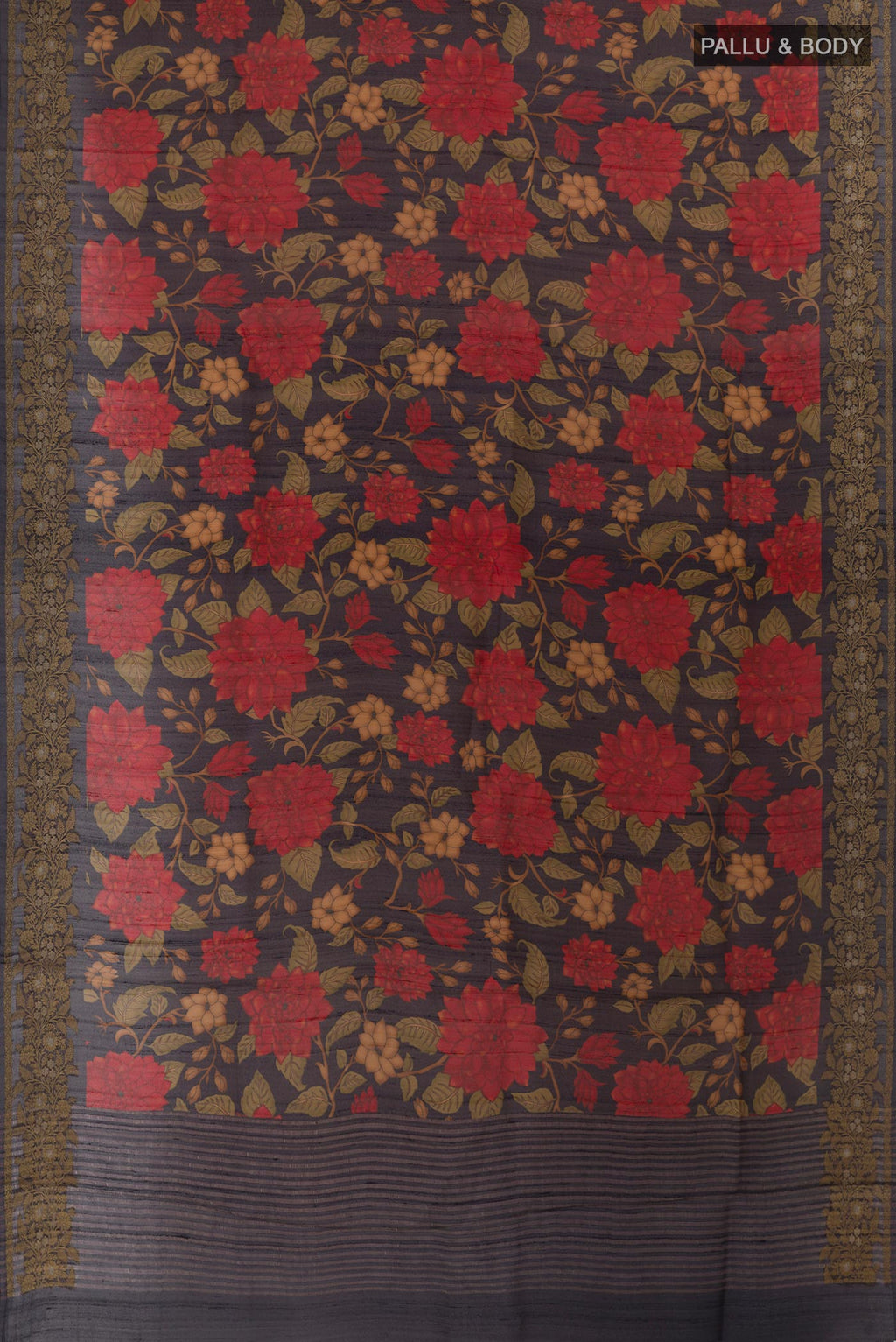 Flat view of Navy Blue Tussar Silk Saree with Printed design on the body and Zari Border. 