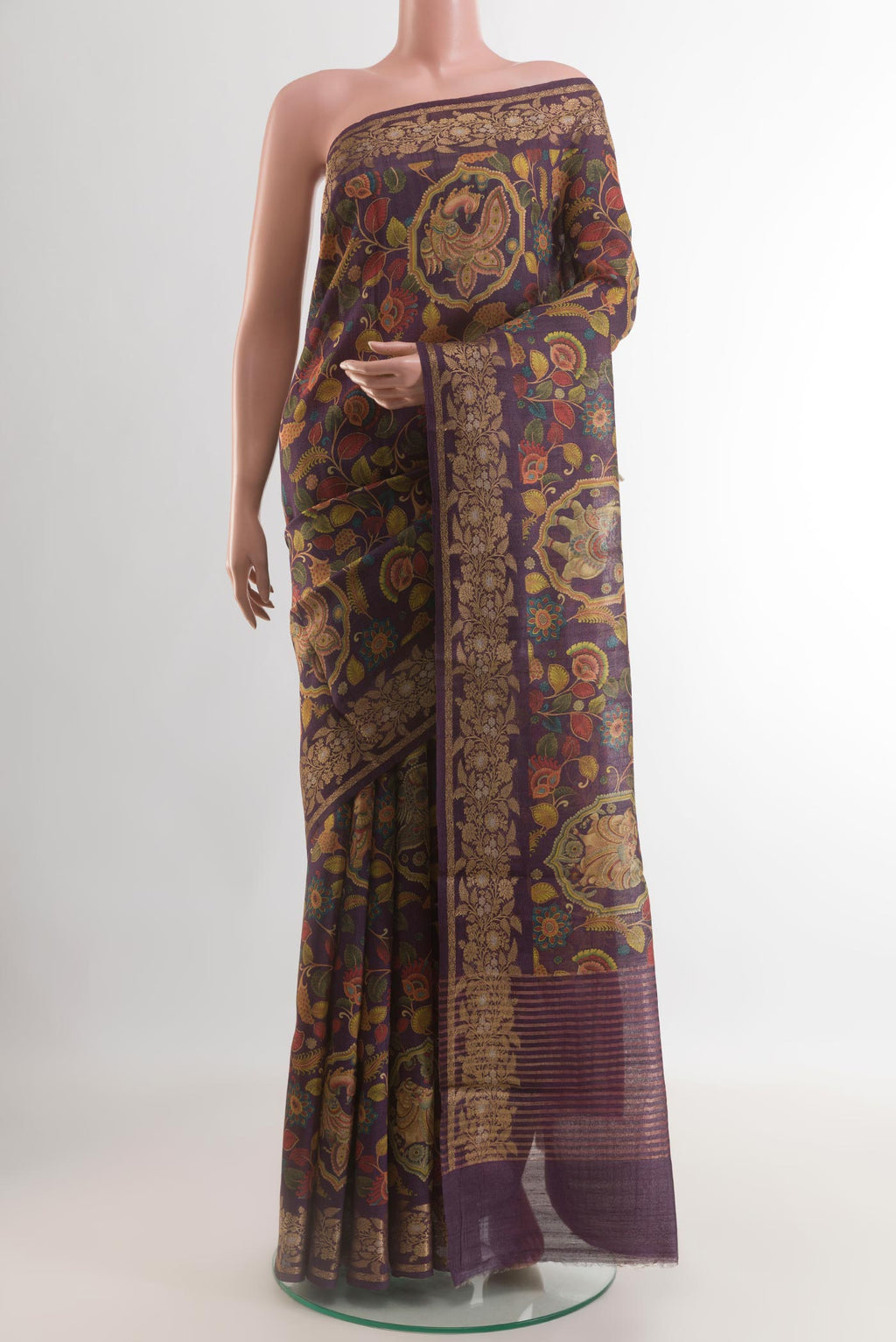 Purple Tussar Silk Saree with kalamkari Print on the body and Zari Border.  displayed on a mannequin