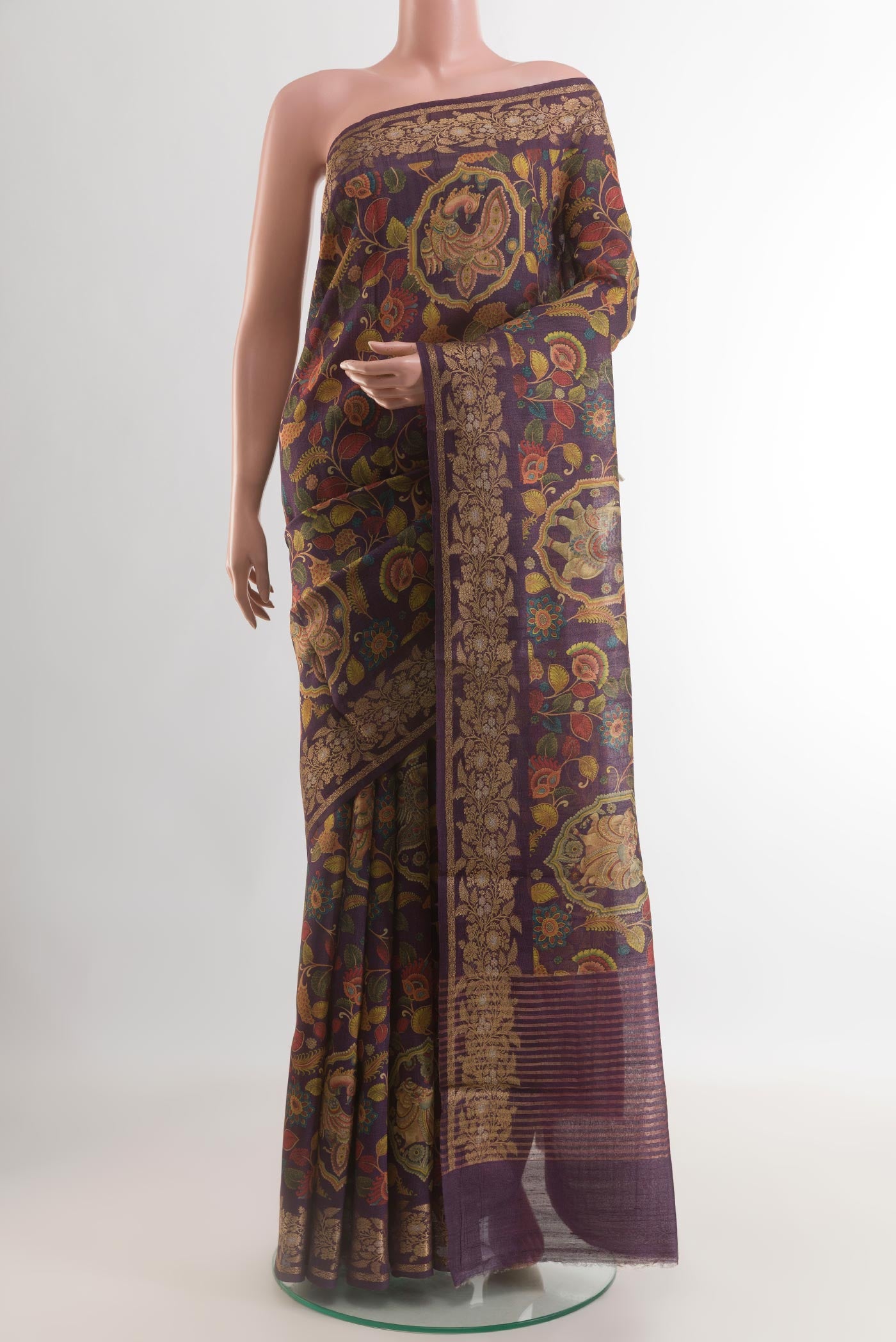 Purple Tussar Silk Saree with kalamkari Print on the body and Zari Border.  displayed on a mannequin