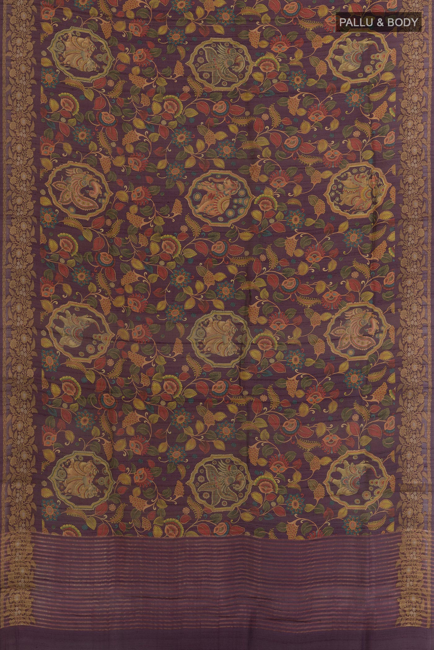 Flat view of Purple Tussar Silk Saree with kalamkari Print on the body and Zari Border. 