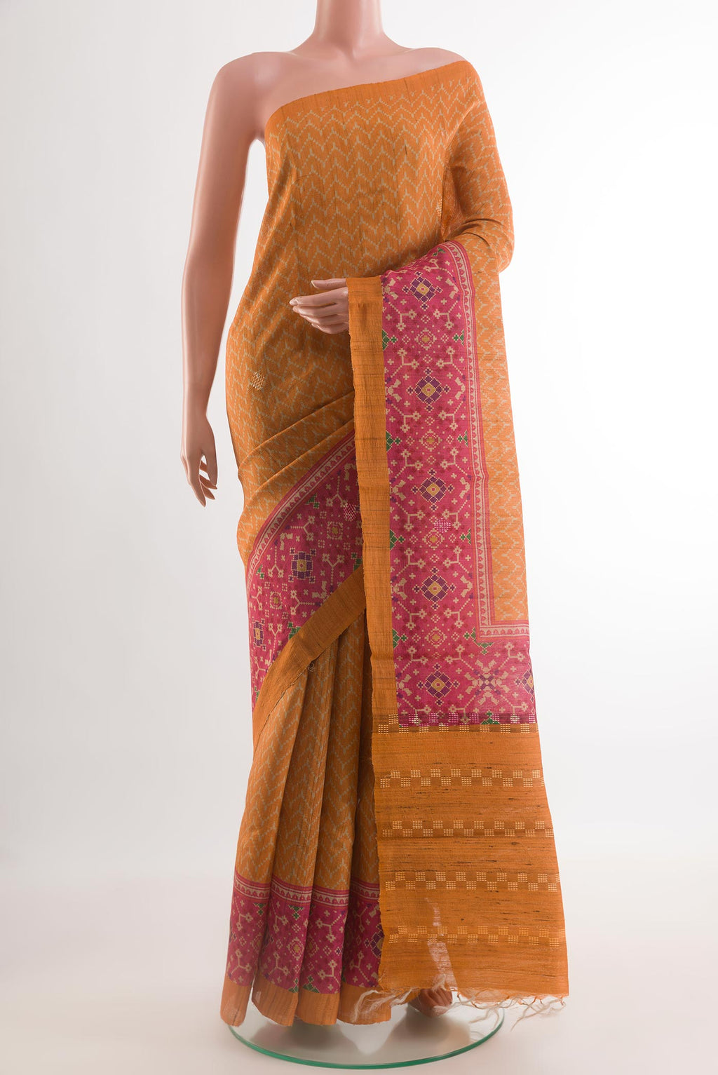 Yellow Tussar Silk Saree with Printed design on the body and Printed Border.  displayed on a mannequin