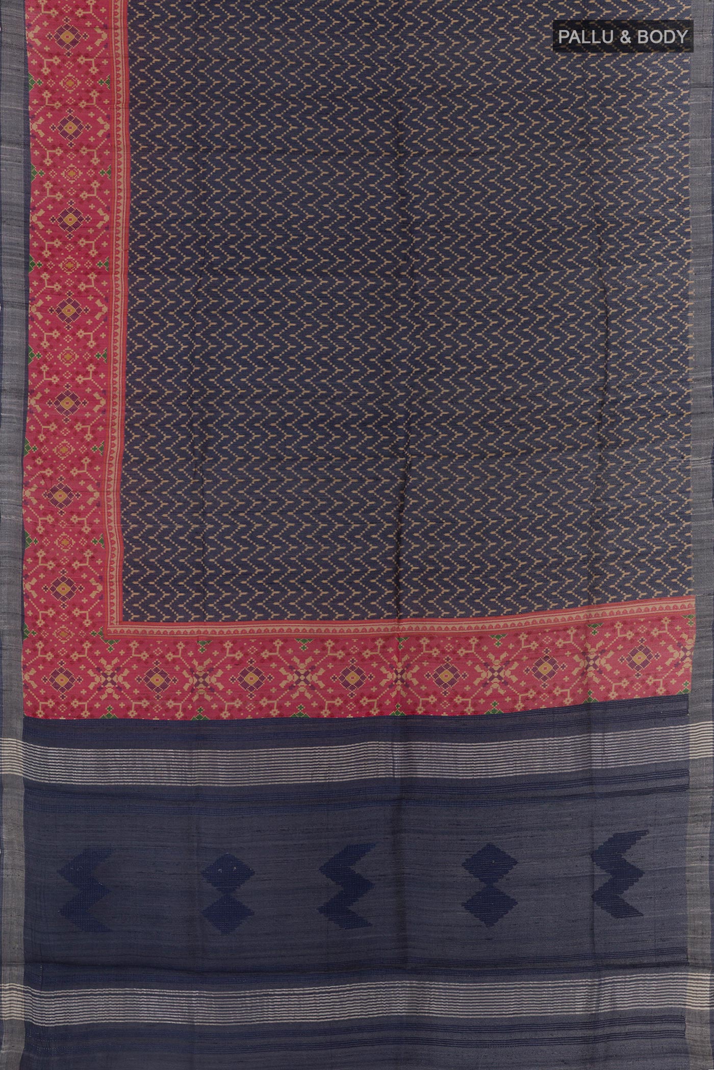 Flat view of Navy Blue Tussar Silk Saree with Printed design on the body and Printed Border. 