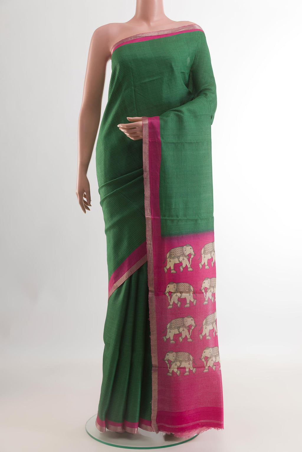 Green Tussar Silk Saree with Plain Body and Zari Border.  displayed on a mannequin