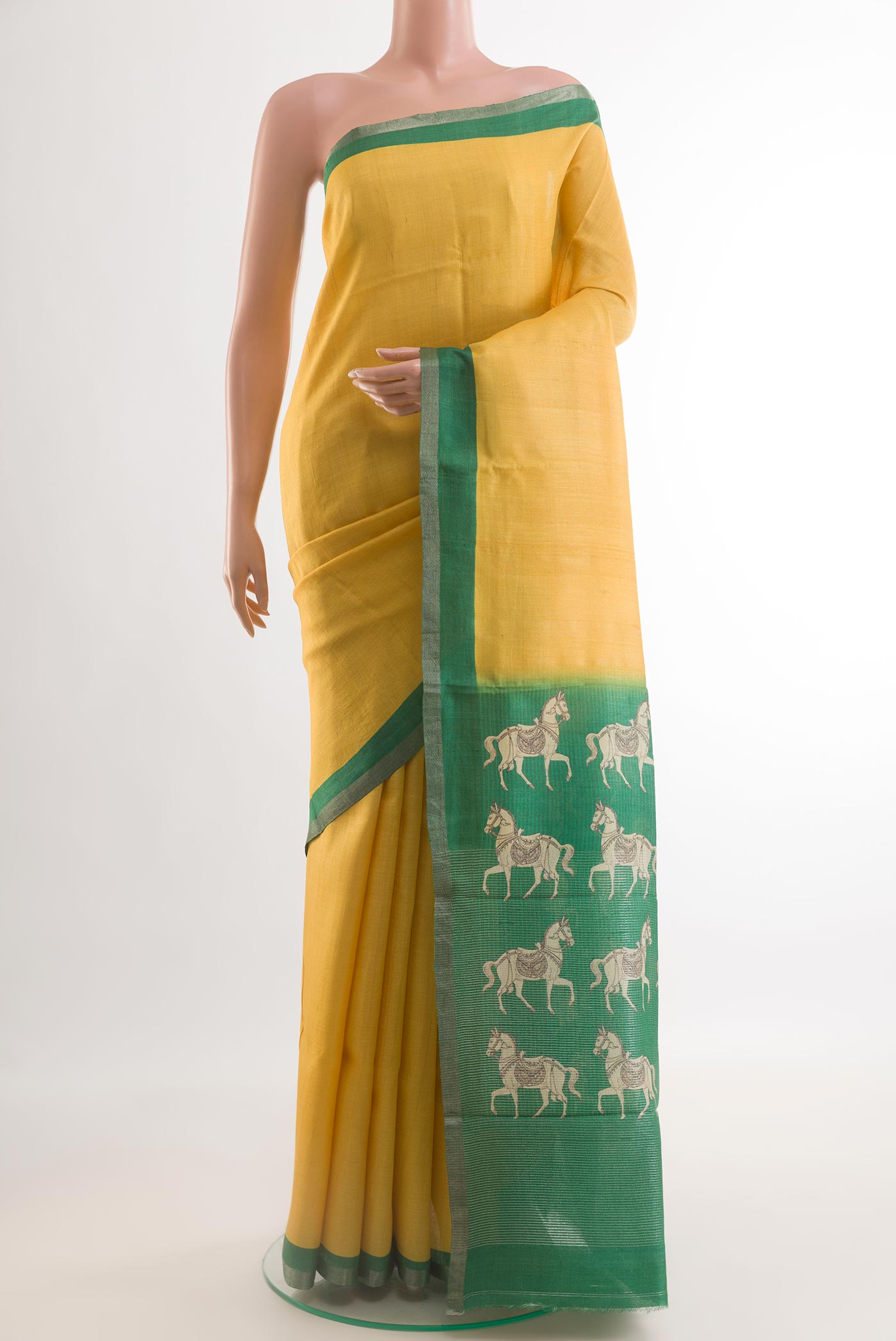 Yellow Tussar Saree with Plain Body and Printed Border.  displayed on a mannequin