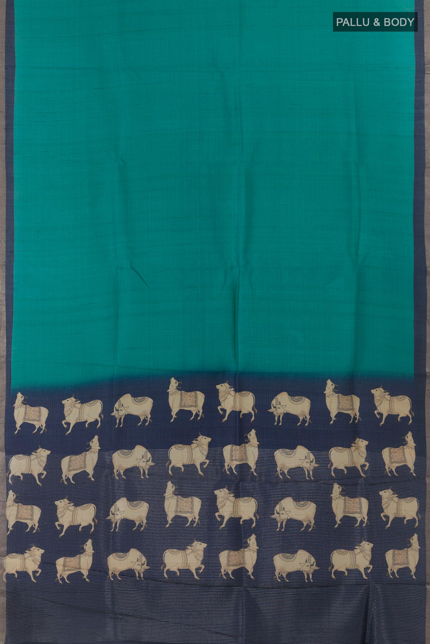 Flat view of Turquoise Tussar Silk Saree with Plain Body and Printed Border. 