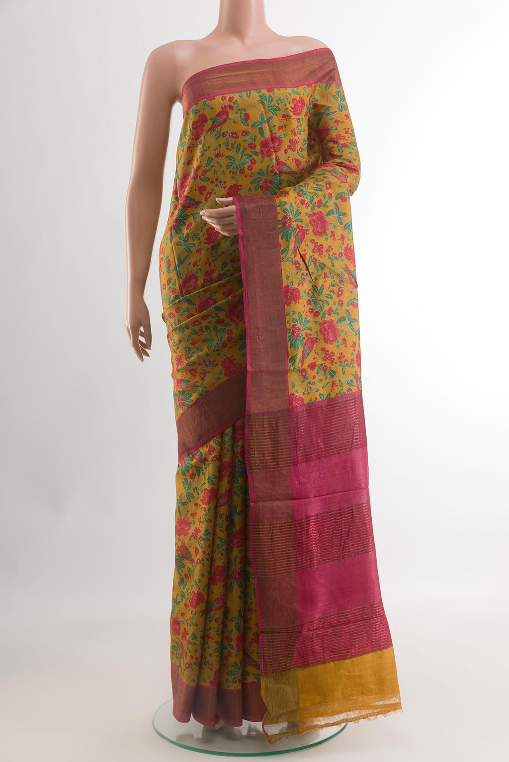 Yellow Tussar Silk Saree with Printed design on the body and Zari Border.  displayed on a mannequin