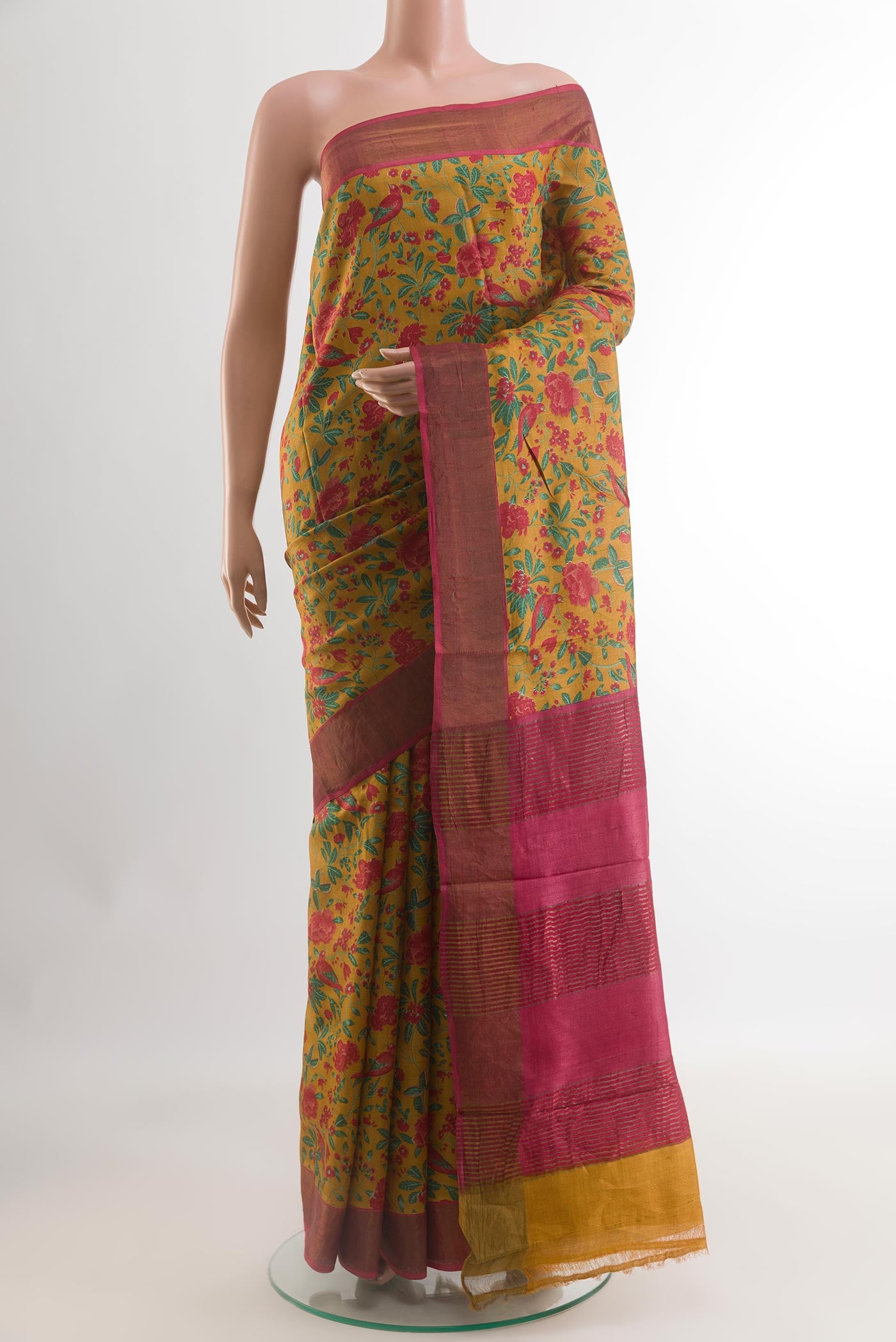 Yellow Tussar Silk Saree with Printed design on the body and Zari Border.  displayed on a mannequin