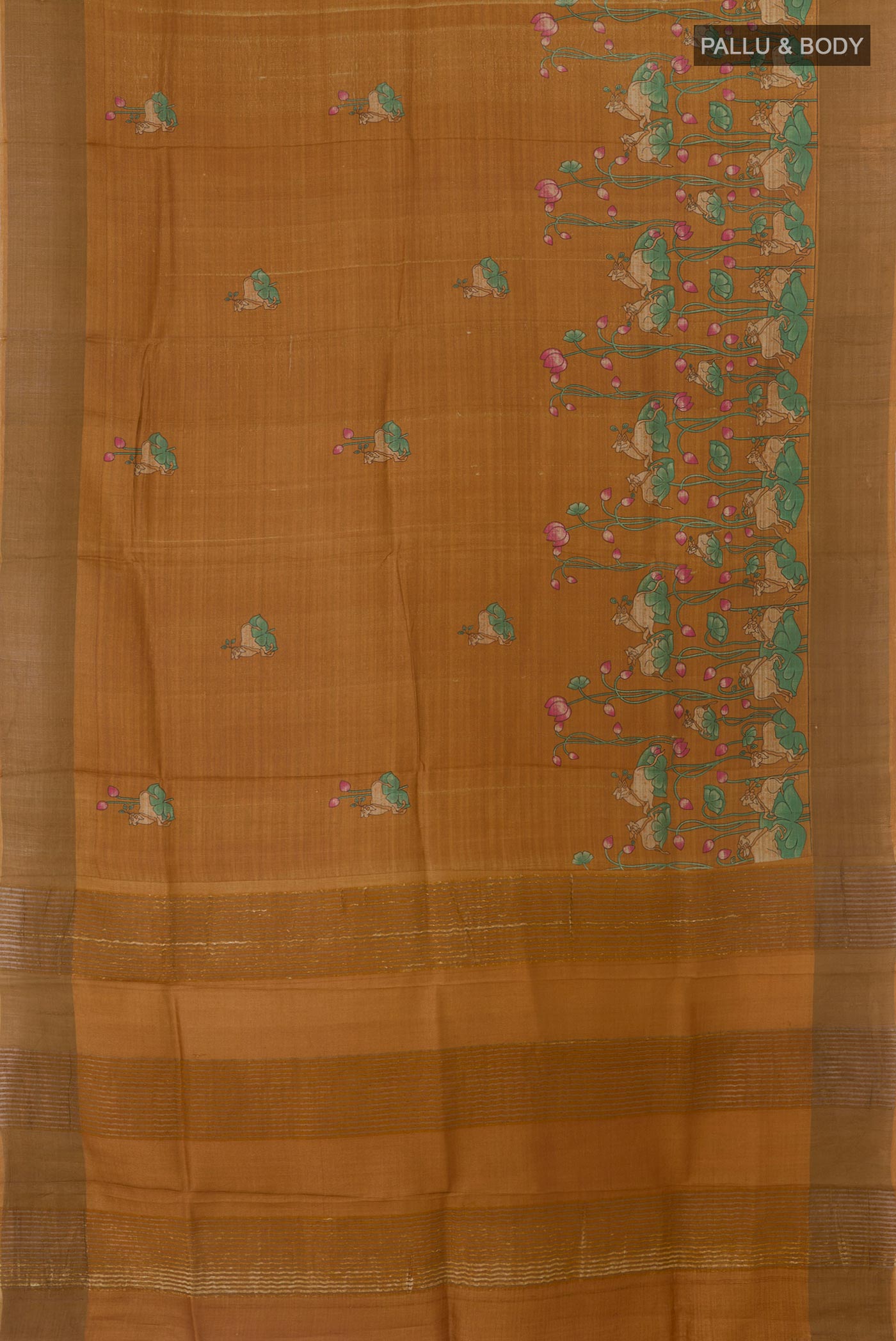 Flat view of Brown Tussar Silk Saree with Printed design on the body and Zari Border. 