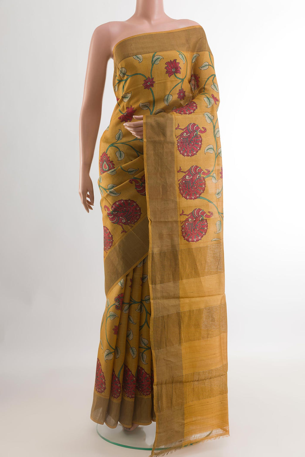 Yellow Tussar Silk Saree with Printed design on the body and Zari Border.  displayed on a mannequin