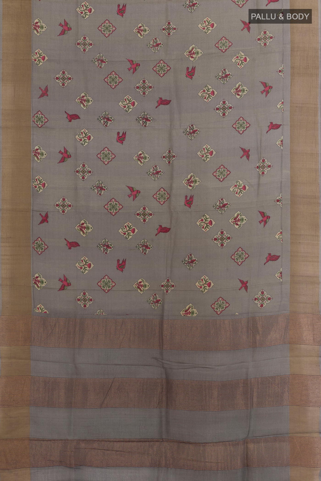Flat view of Grey Tussar Silk Saree with Printed design on the body and Zari Border. 