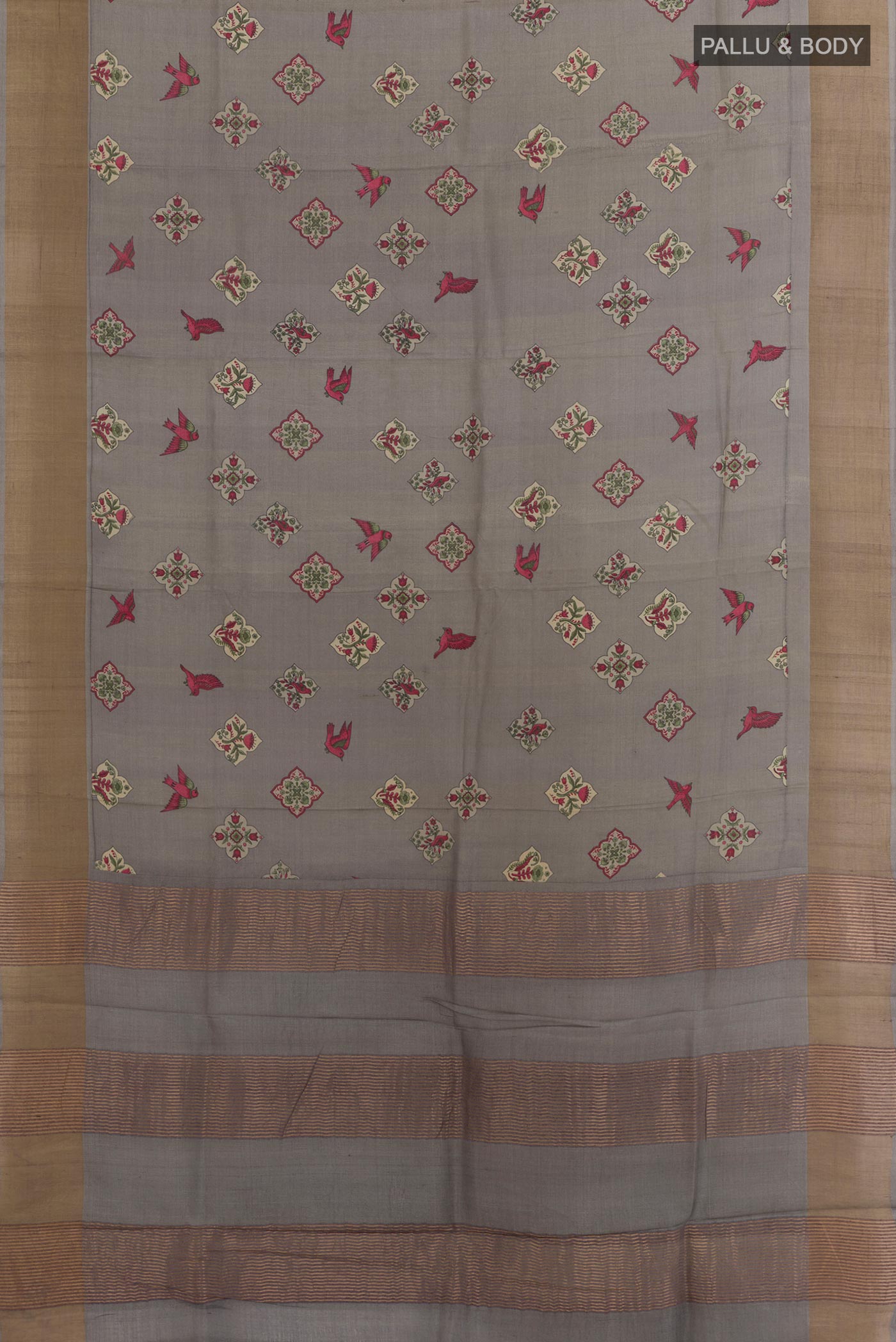 Flat view of Grey Tussar Silk Saree with Printed design on the body and Zari Border. 