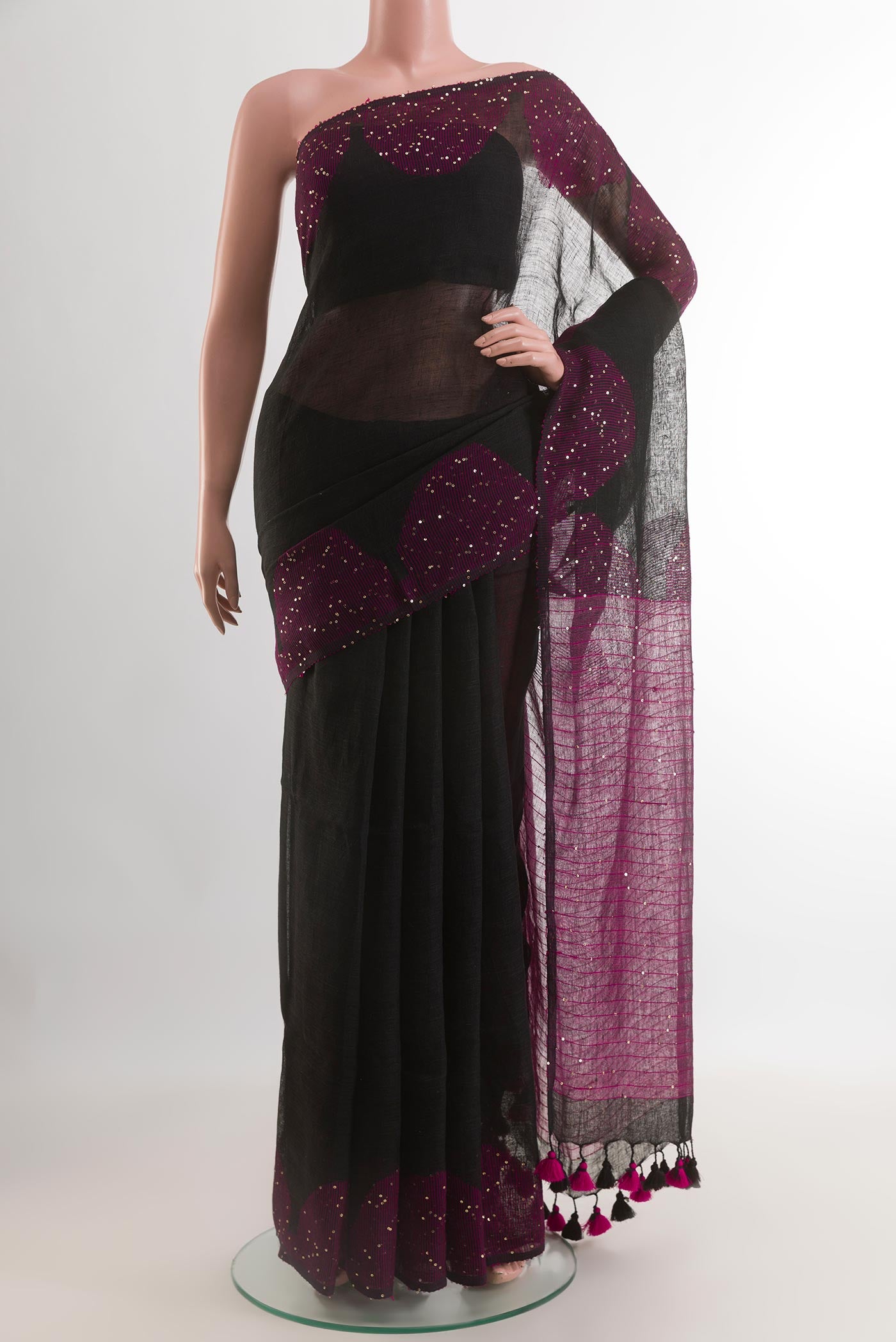 Black Linen Saree with Embroidery on the body and Embroidery Border.  displayed on a mannequin