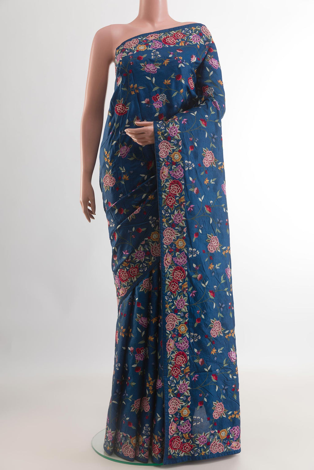 Blue Tussar Silk Saree with Embroidery on the body and Embroidery Border.  displayed on a mannequin
