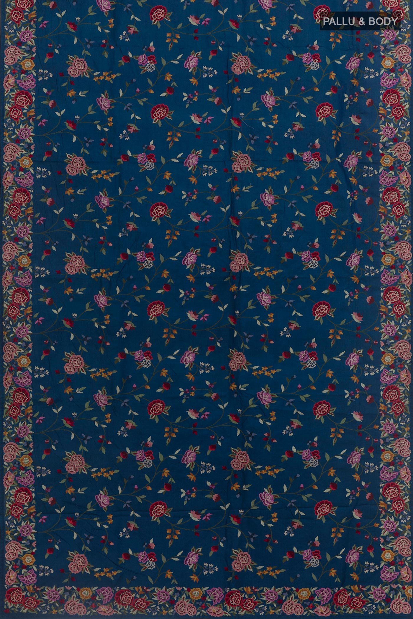 Flat view of Blue Tussar Silk Saree with Embroidery on the body and Embroidery Border. 