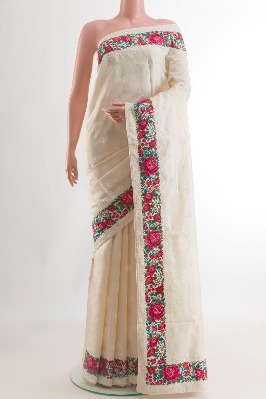 Off White Tussar Silk Saree with Embroidery on the body and Embroidery Border.  displayed on a mannequin