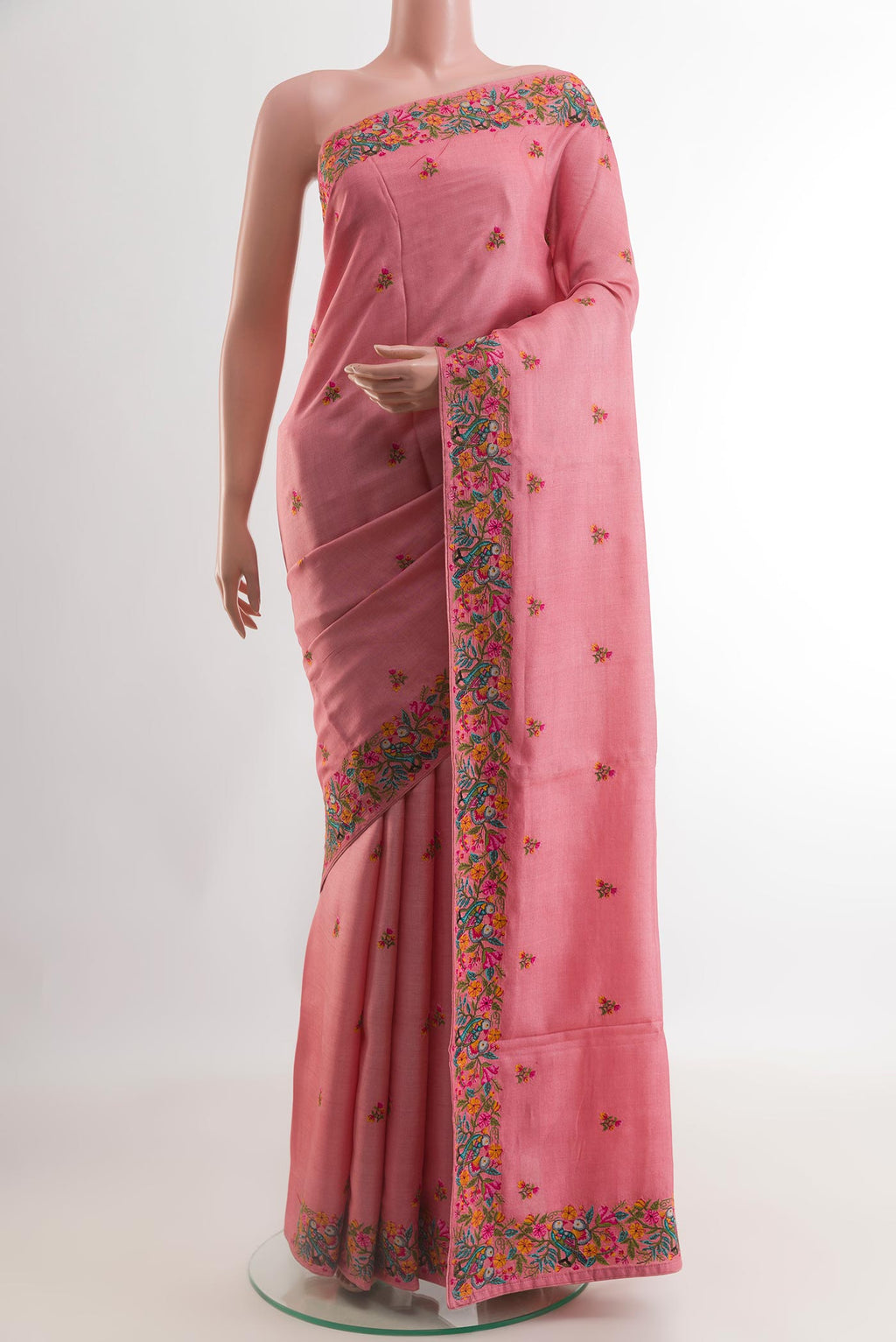 Pink Tussar Silk Saree with Embroidery on the body and Embroidery Border.  displayed on a mannequin