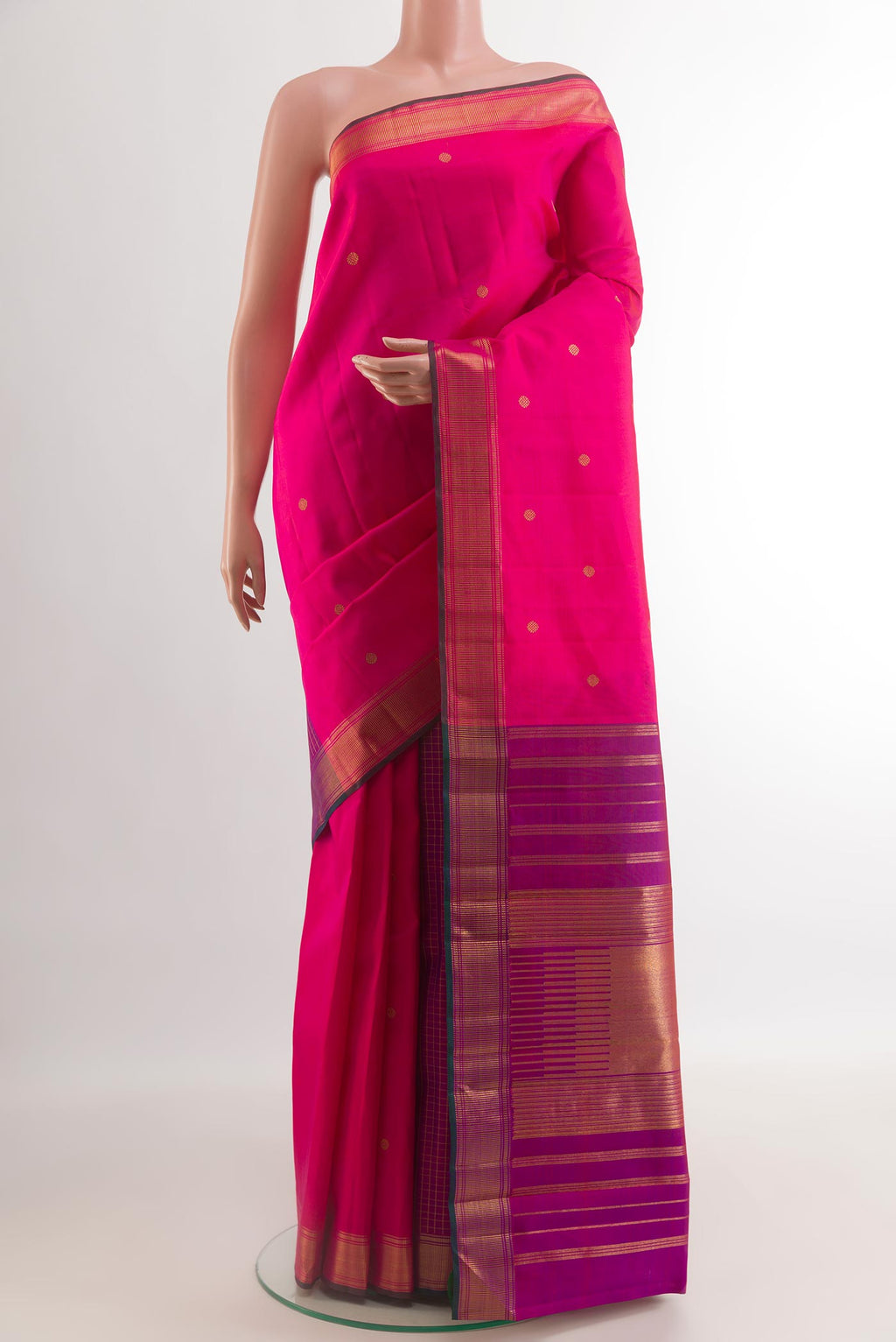 Pink Kanchipuram Silk Saree with Zari Butta on the body and Zari Border.  displayed on a mannequin
