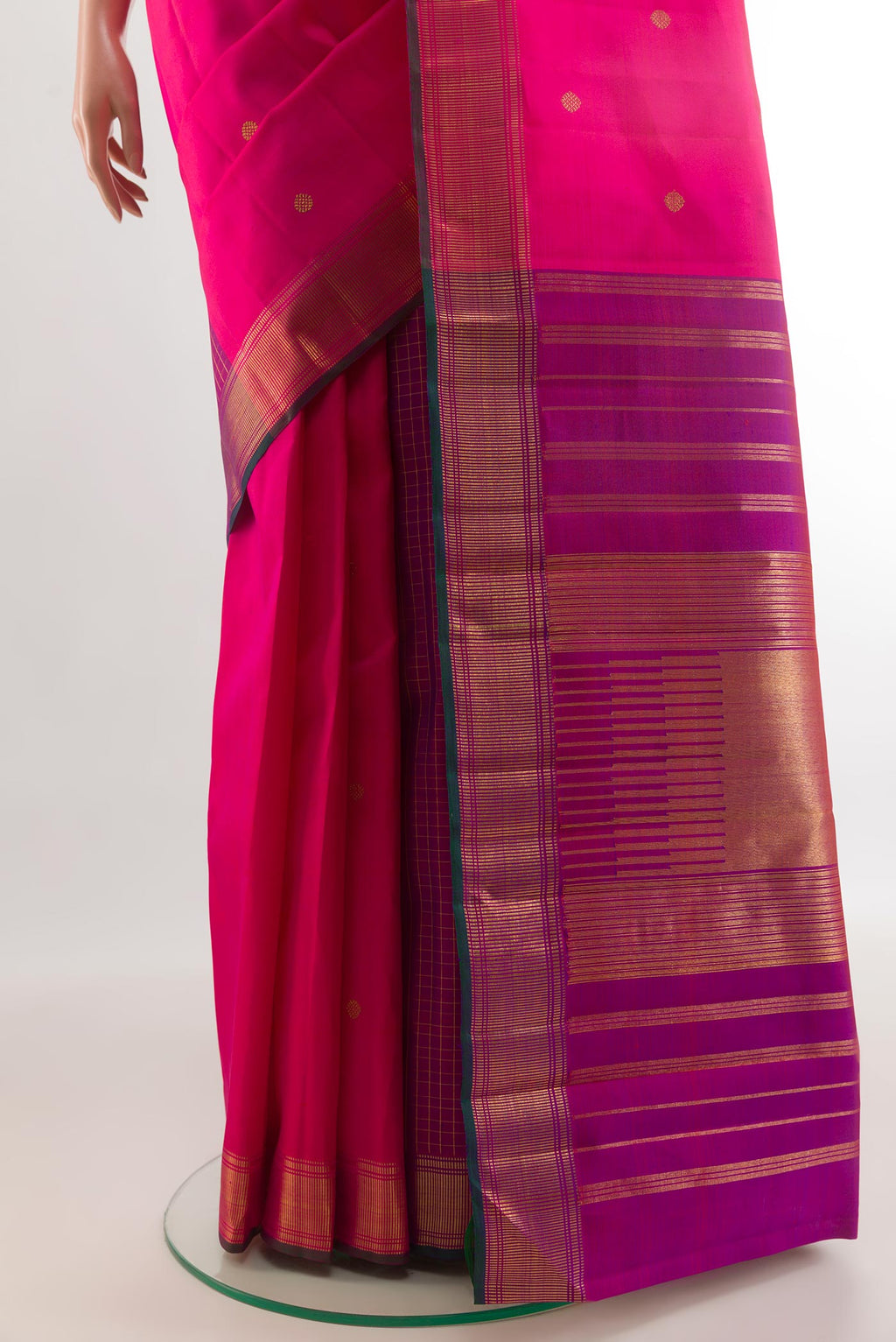 Pleats and pallu of Pink Kanchipuram Silk Saree with Zari Butta on the body and Zari Border. 