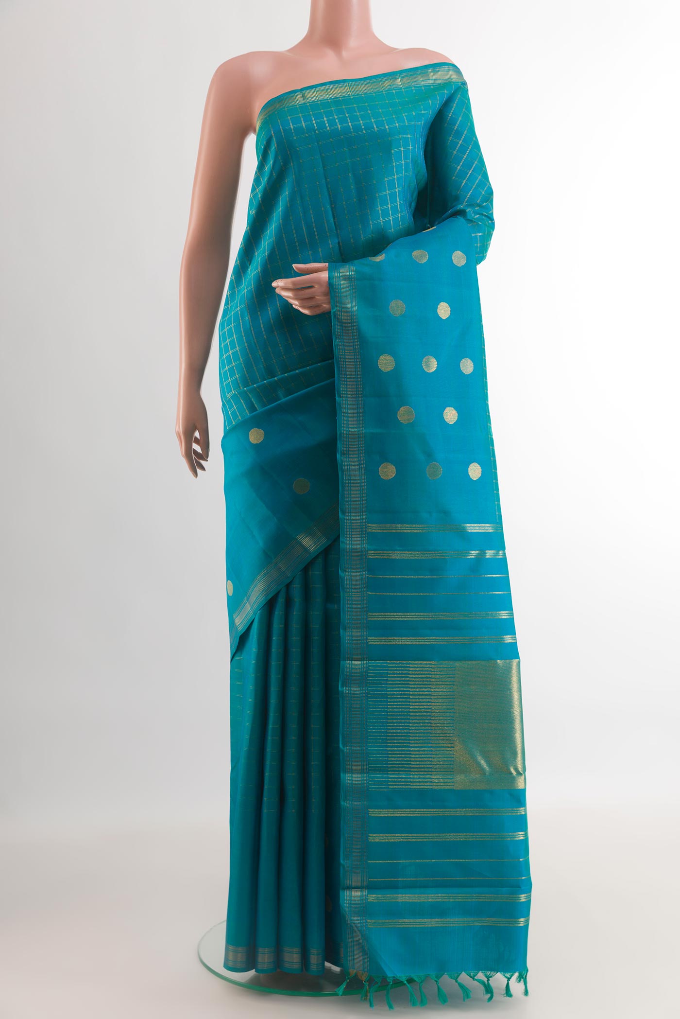 Blue Kanchipuram Silk Saree with Checked design on the body and Zari Border.  displayed on a mannequin