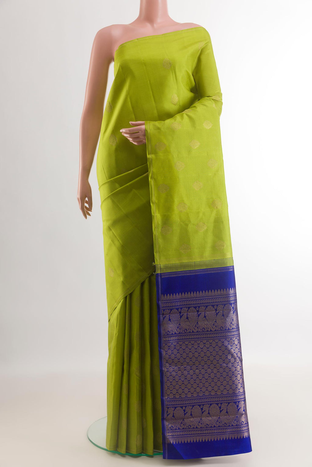 Green Kanchipuram Silk Saree with Zari Butta on the body and Without Border.  displayed on a mannequin