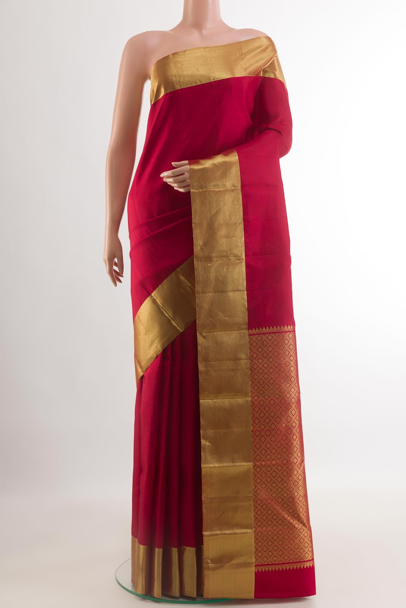Red Kanjivaram Silk Saree with Plain Body and Zari Border.  displayed on a mannequin