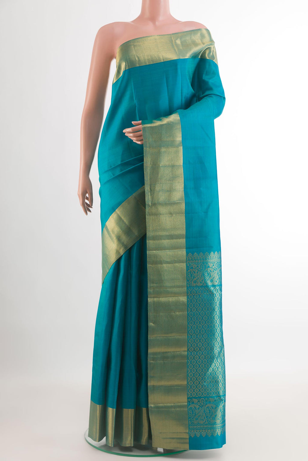 Blue Kanjivaram Silk Saree with Plain Body and Zari Border.  displayed on a mannequin