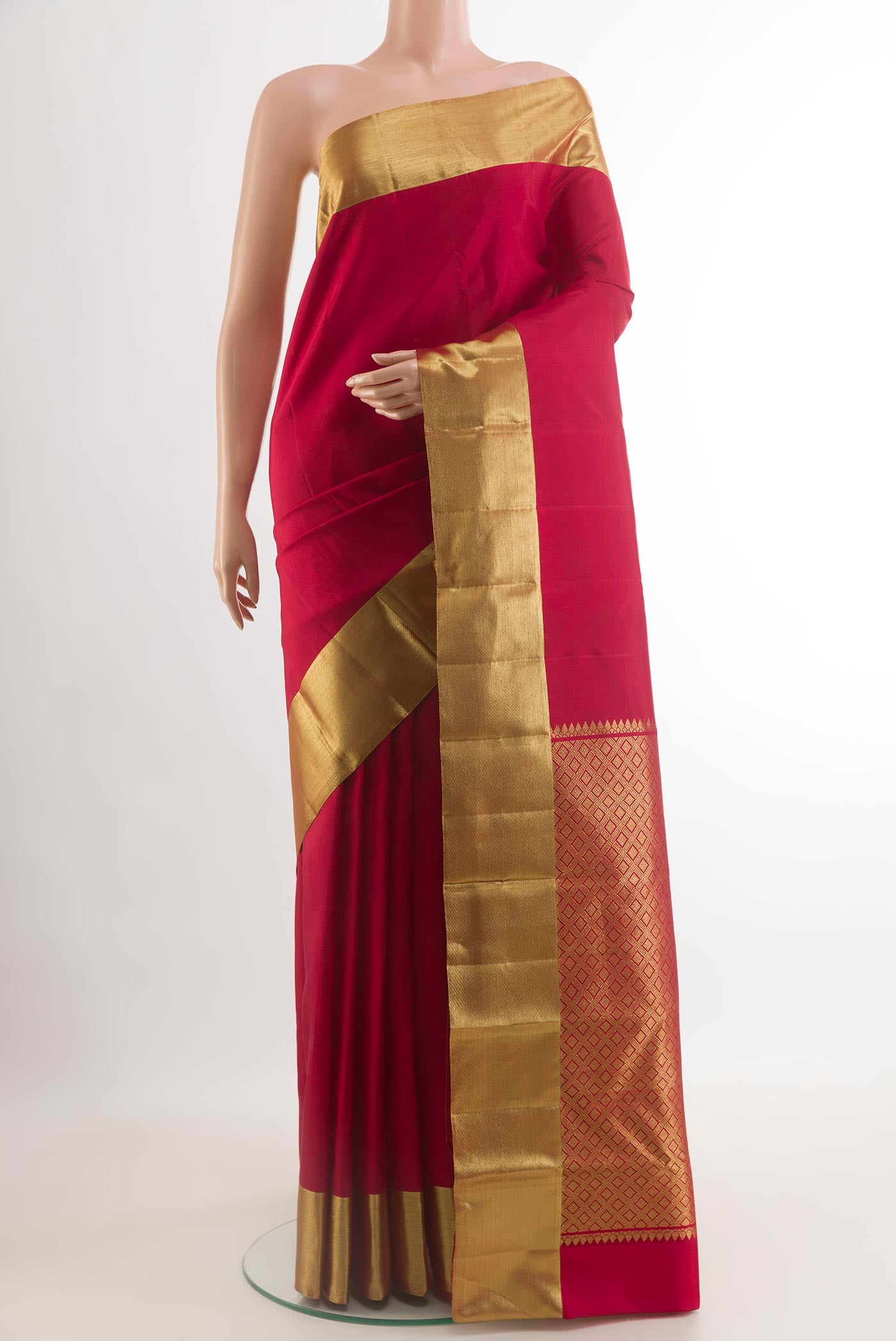 Red Kanjivaram Silk Saree with Plain Body and Zari Border.  displayed on a mannequin